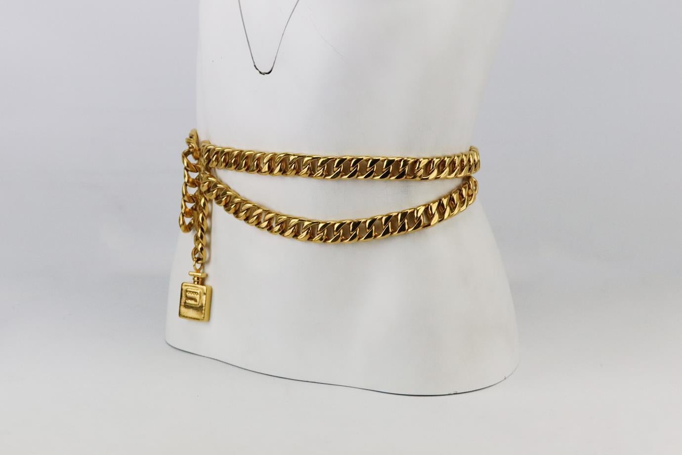 Chanel Vintage Coco Chanel perfume bottle chain waist belt. Made from large gold-tone chain with Coco Chanel perfume bottle pendant. Gold. Hook fastening at front. Length: 30 in. Width: 0.7 in