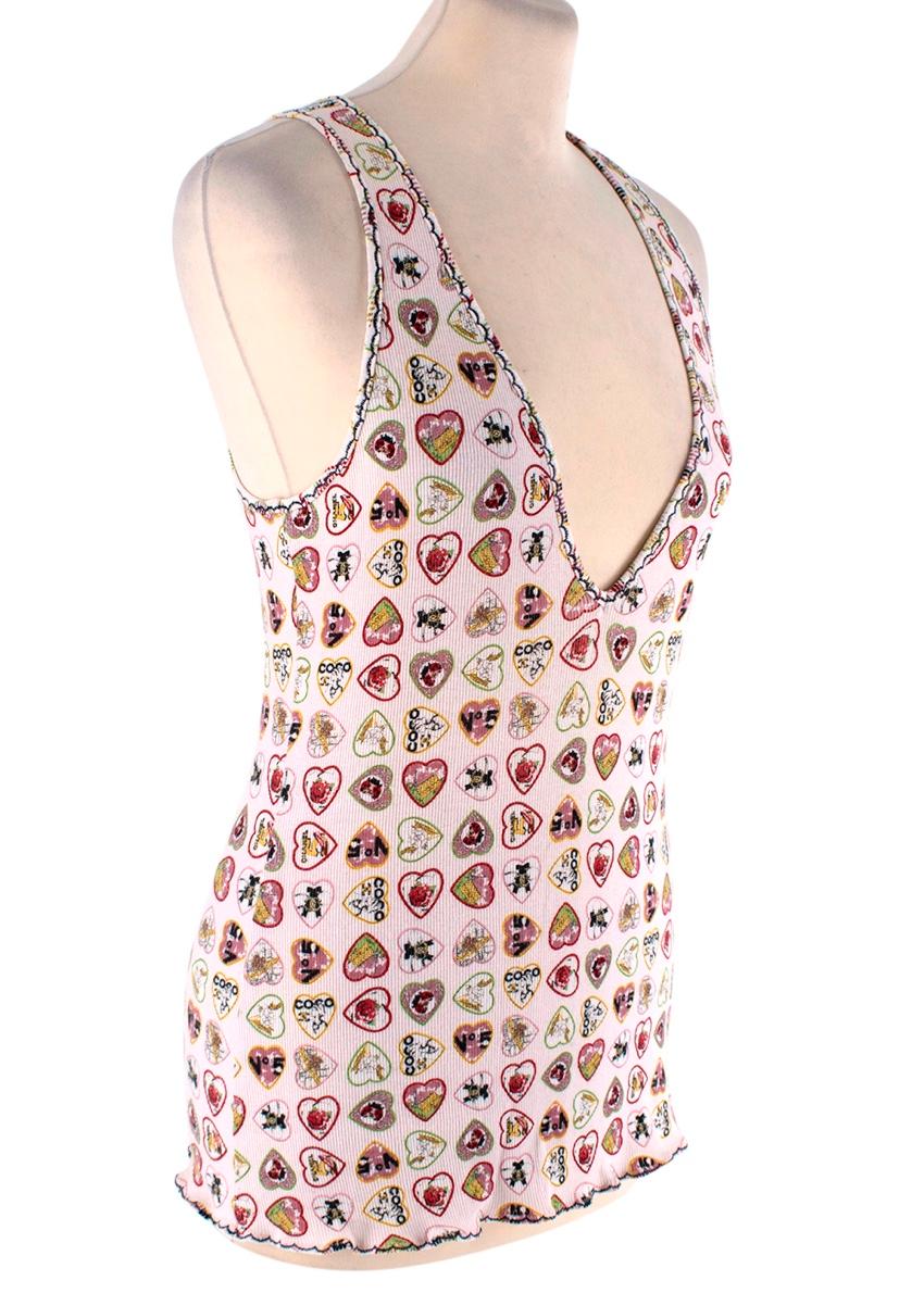 Chanel Vintage Coco Valentine Print Vest

- 2006
- Stretch fine rib cotton with an allover love heart sweet pattern with Coco motifs
- Fluted hems 
- Sleeveless
- Deep v-neckline

Materials 
95% Cotton 
5% Spandex 

Made in Italy 
Wash at