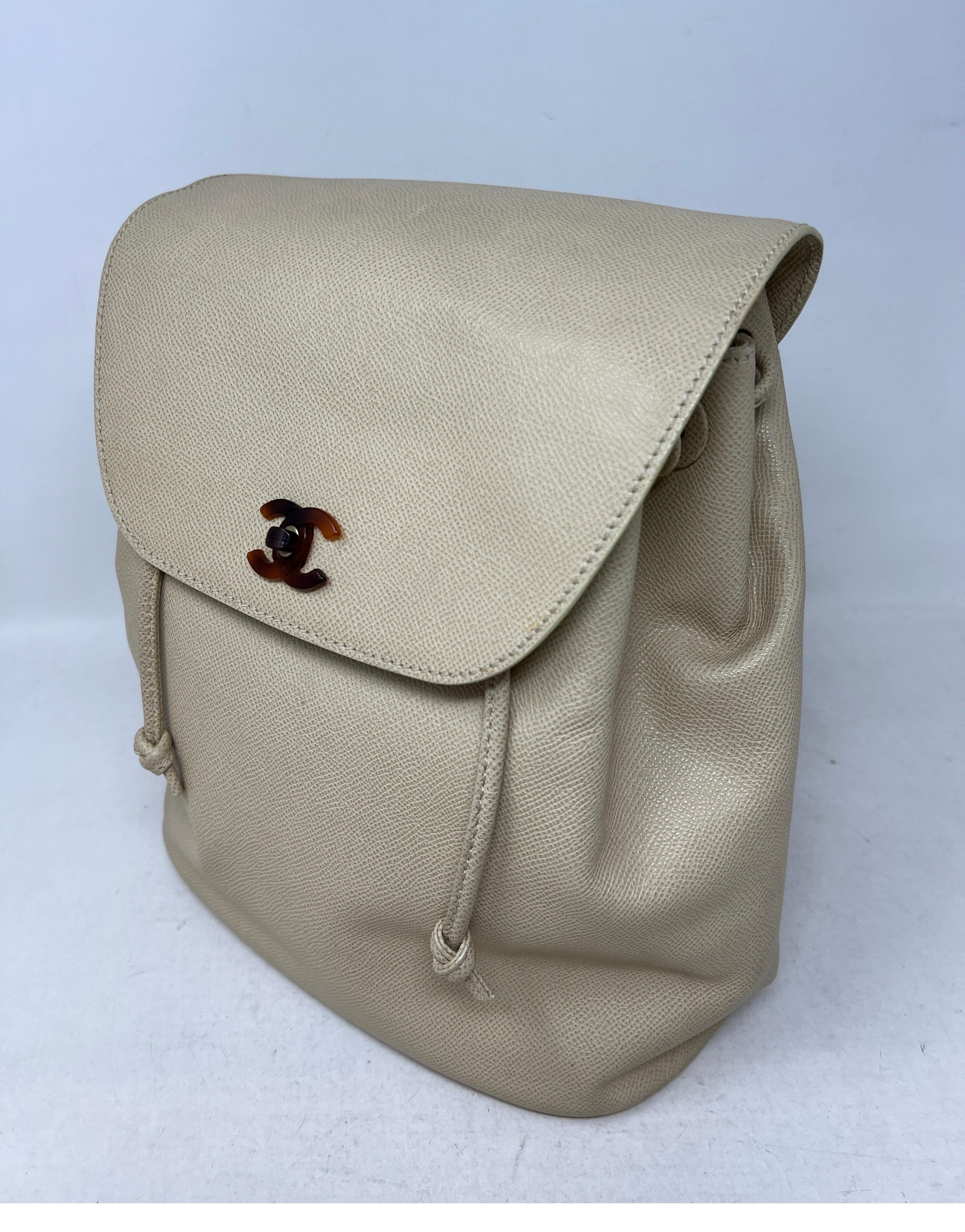 Chanel Cream Backpack. Vintage leather backpack with plastic tortoise clasp and details. Collector's bag. Interior minor wear. Medium size backpack. Great for everyday or travel bag. Guaranteed authentic. 