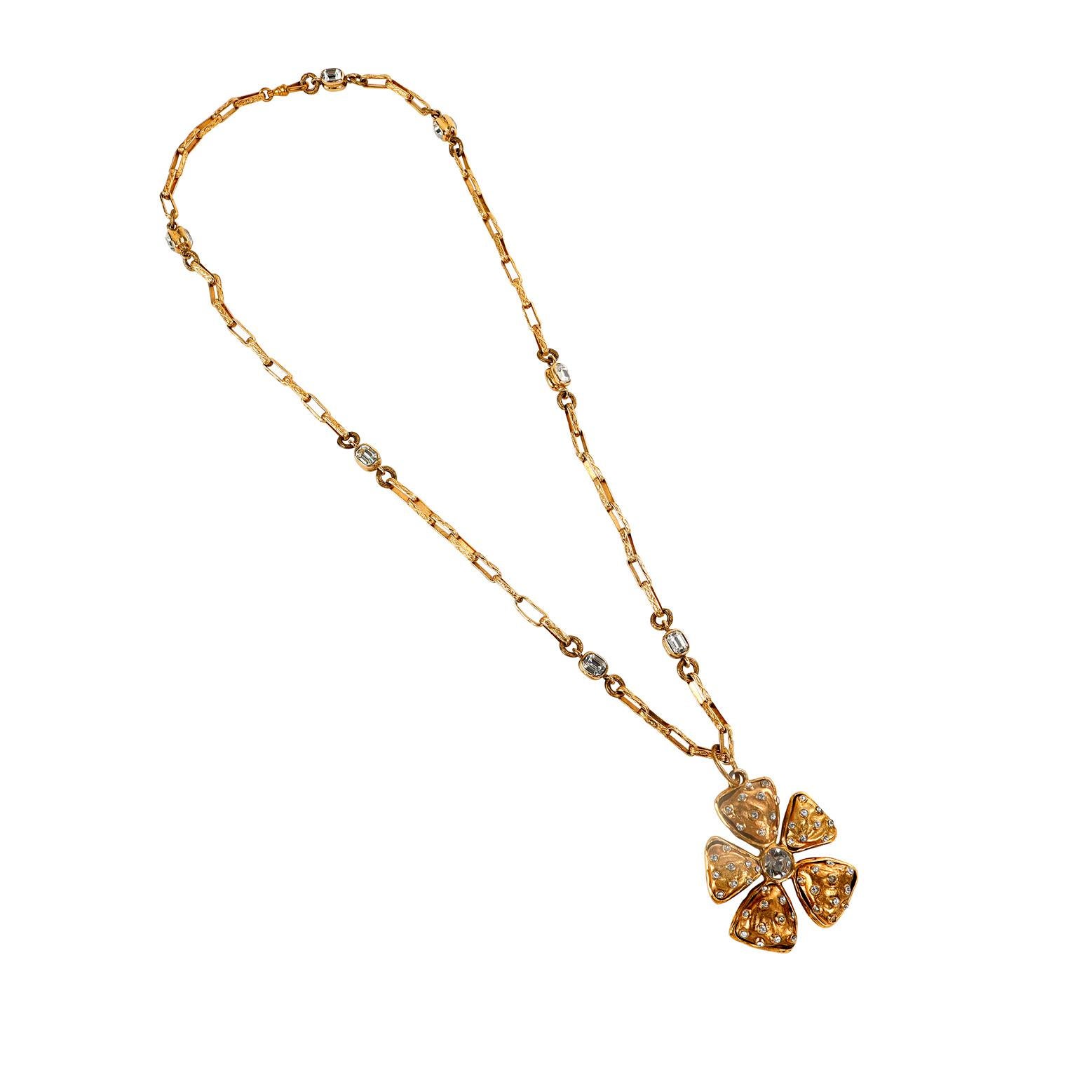 This authentic Chanel Crystal and Gold Camellia Necklace is in pristine vintage condition from the late 70’s- early 80’s era. 24 karat gold plated large camellia flower is adorned with crystals on the petals and in the center.  Dangles delicately