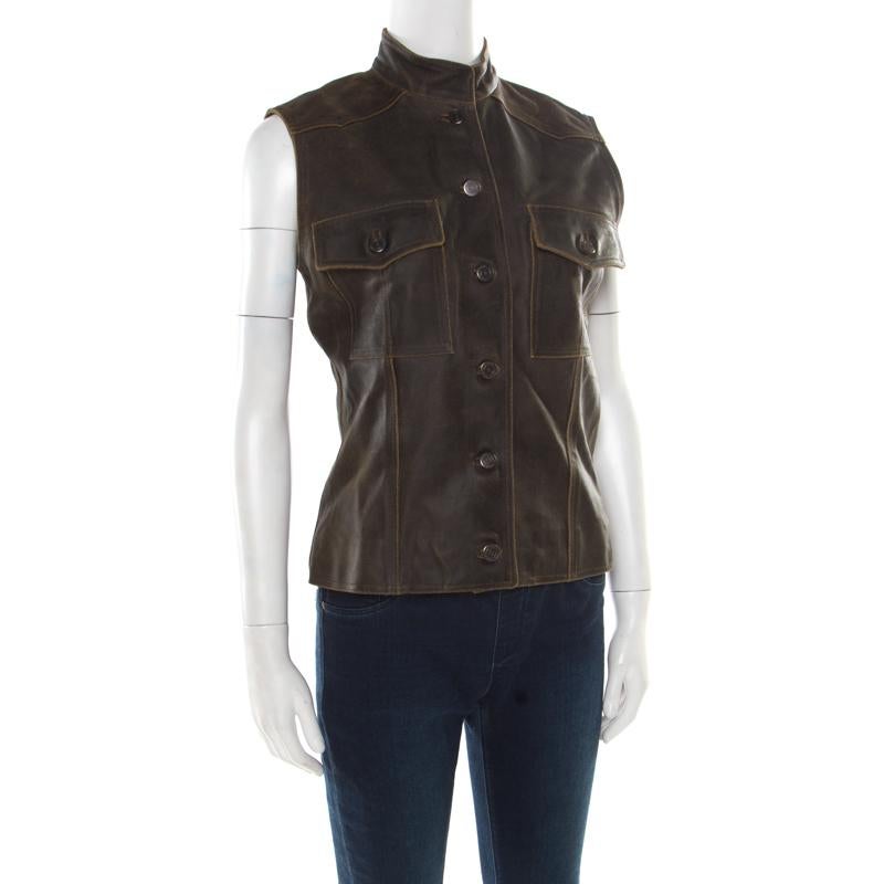 Let your closet experience a stylish addition with this vest from Chanel. It is well tailored from dark brown calfskin leather and features a buttoned fastening at the front embossed with the signature CC logo. It has a stylish silhouette,