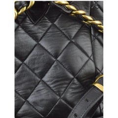 CHANEL Vintage Duma Matelasse Rucksack aus Leder und Lammfell in Schwarz und Goldtönen CC