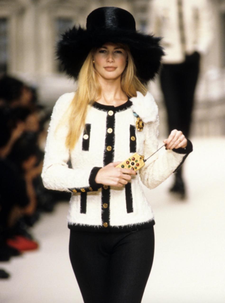 Rare and the most wanted tweed jacket from Chanel Fall 1994 collection by Karl Lagerfeld. As seen on Claudia Schiffer.Such an iconic piece, quintessential Chanel, highly coveted by collectors around the world. The jacket features ivory/ecru tweed