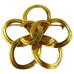 Chanel Vintage Fall 1997 Gold Toned Stylized Flower and CC Brooch