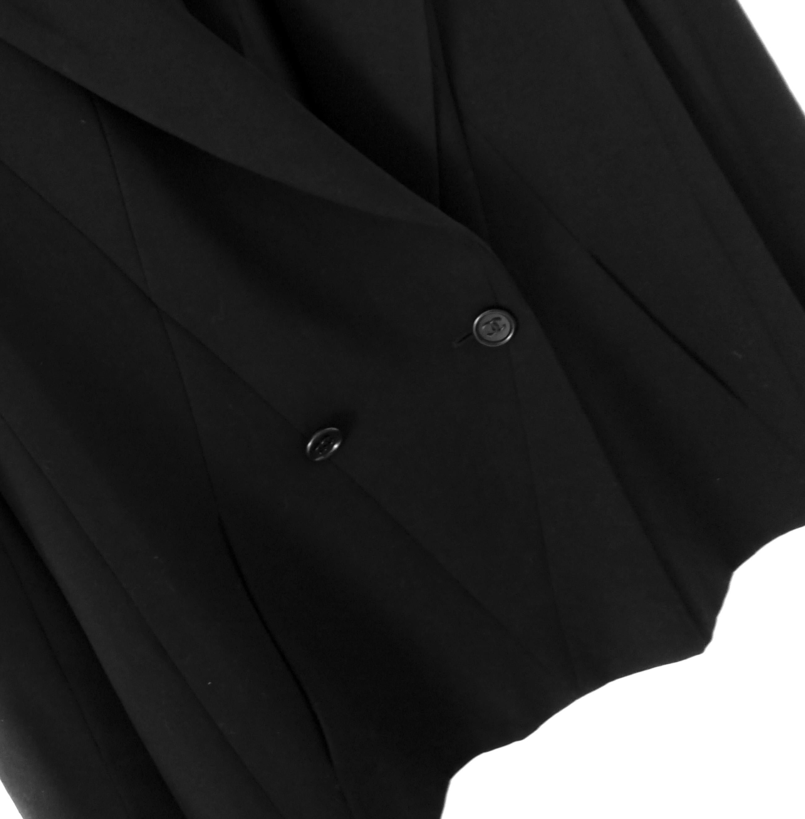 Iconic vintage Chanel black jacket from the Fall 1998 collection. As seen on Kate Moss at the start of the runway show. Worn twice and in immaculate condition. Made from smooth black wool with sharp, graphic seaming throughout. It has a semi relaxed