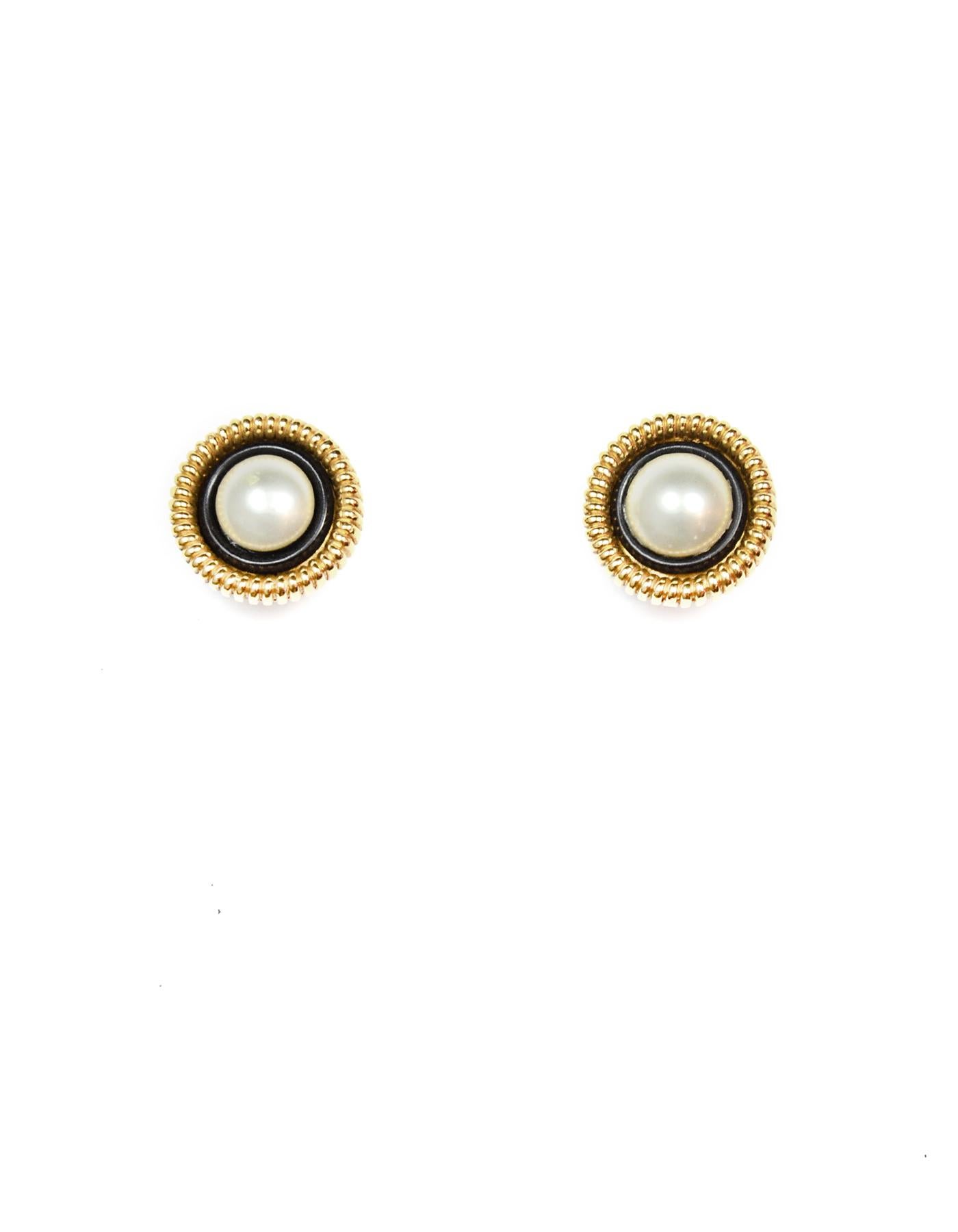 Chanel Vintage Faux Pearl/Goldtone Clip On Earrings

Color: Gold, black, white
Materials:  Metal, faux pearl
Hallmarks:   
