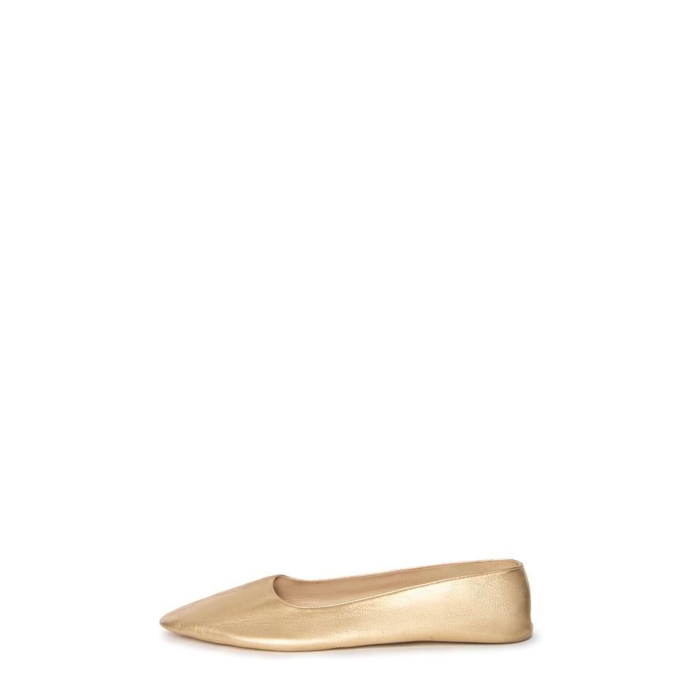 These chic Chanel gold flats exude understated luxury and sophistication. Crafted from high-quality materials, these shoes offer a sleek and minimalist design, perfect for any occasion. 

With a pointed toe and soft, flexible construction, they