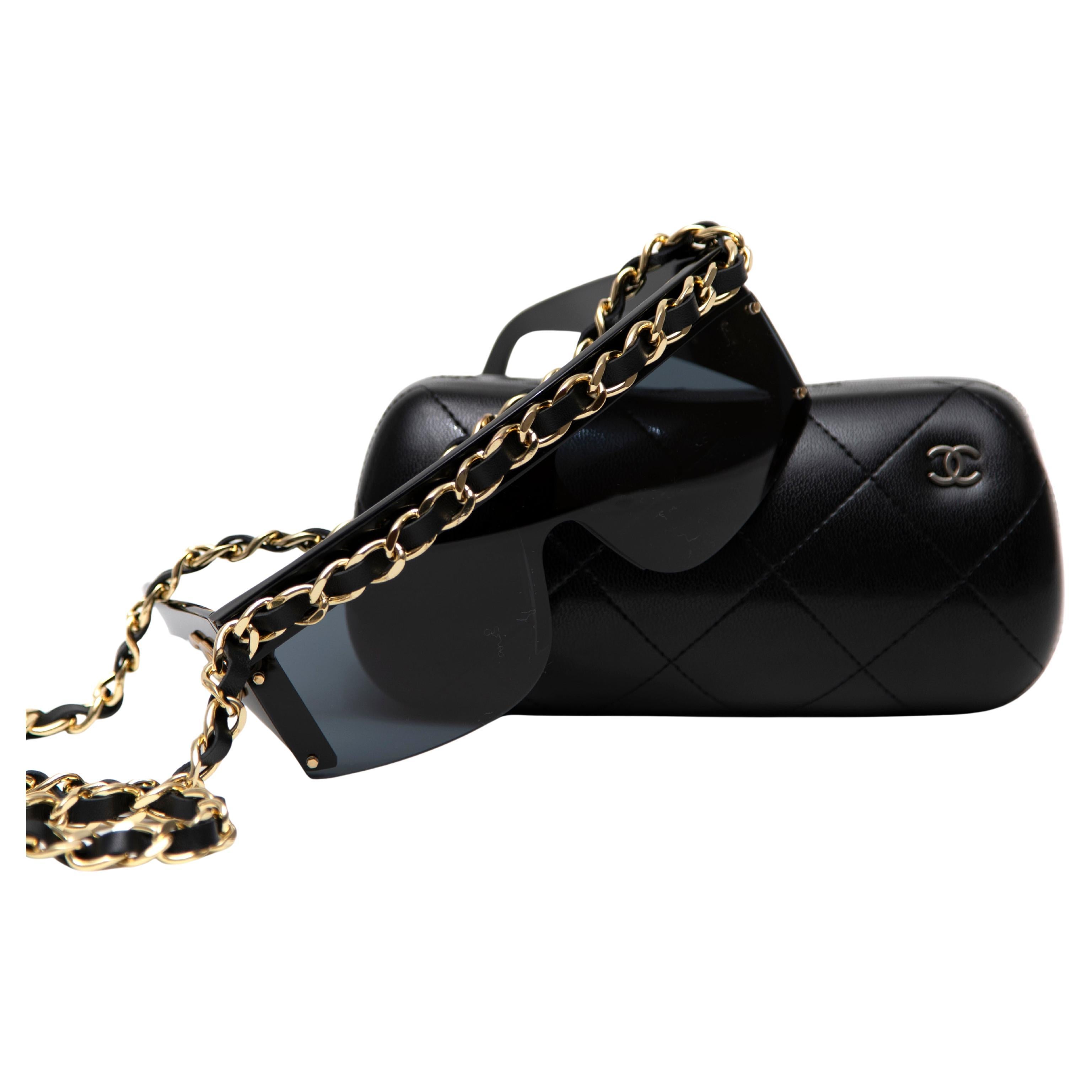These Chanel Vintage Shield Sunglasses from the iconic Fall/Winter 1992 collection are a rare and highly sought-after piece. Crafted with black acetate and featuring Chanel’s signature gold hardware, these sunglasses showcase the interlocking CC