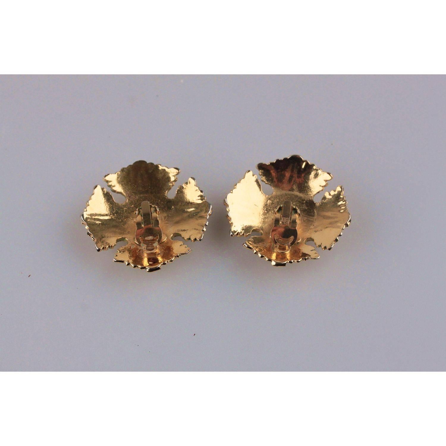 - Clip On Earrings in gold metal by CHANEL
- Signed 'CHANEL 2 CC 3 - Made in France' on the reverse of the earrings
 - Period/ Era: 1986 - 1992 (Victoire de Castellane came to Chanel as Lagerfeld's assistant. Designs from this era are signified by