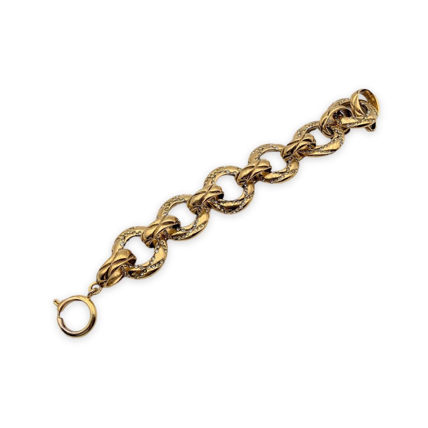 Beautiful bracelet by CHANEL. Round Chain link with quilted pattern. Crystals embellishment. Spring ring closure. 'CHANEL 2 CC 3 Made in France' oval hallmark at the end of the bracelet. Total length:7.5 inches - 19 cm Condition A - EXCELLENT Gently