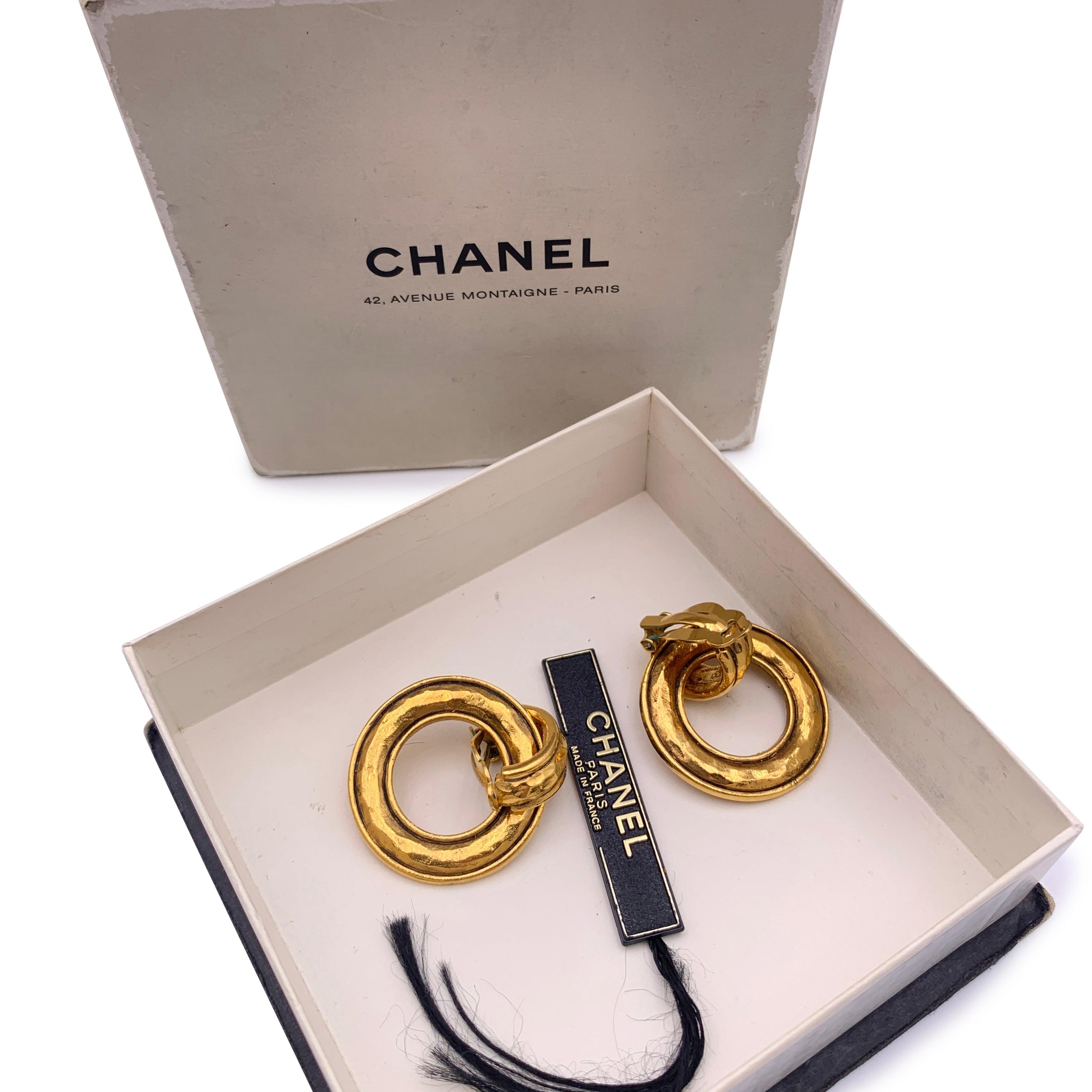 Beautiful vintage clip on door knocker earrings by CHANEL. They are finely crafted in gold metal. Can be used in 2 different way, if you remove the hoop. Clip on closure on the back. 'CHANEL - CC - Made in France' oval tag on the reverse of the
