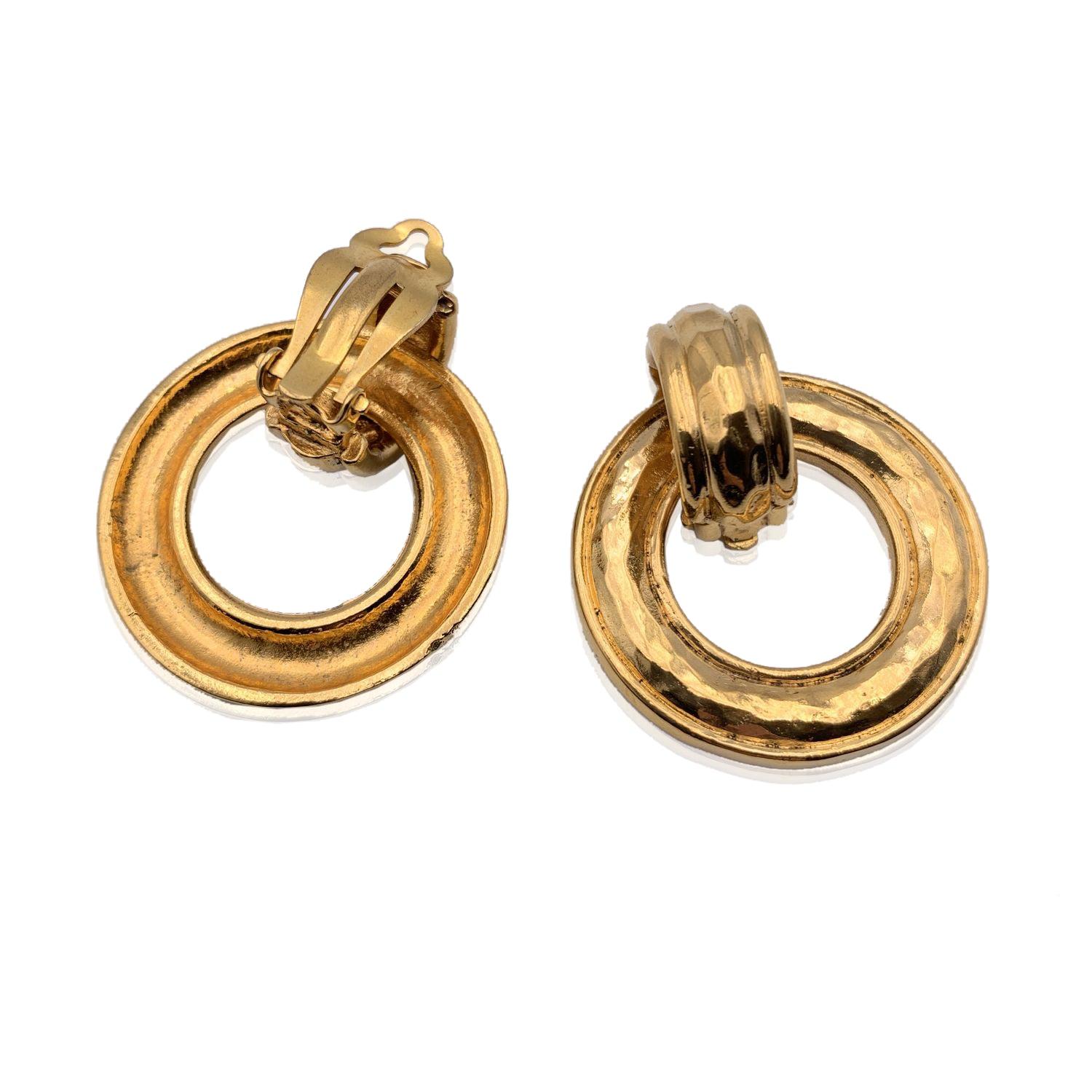 Beautiful vintage clip on door knocker earrings by CHANEL. They are finely crafted in gold metal. Can be used in 2 different way, if you remove the hoop. Clip on closure on the back. 'CHANEL - CC - Made in France' oval tag on the reverse of the