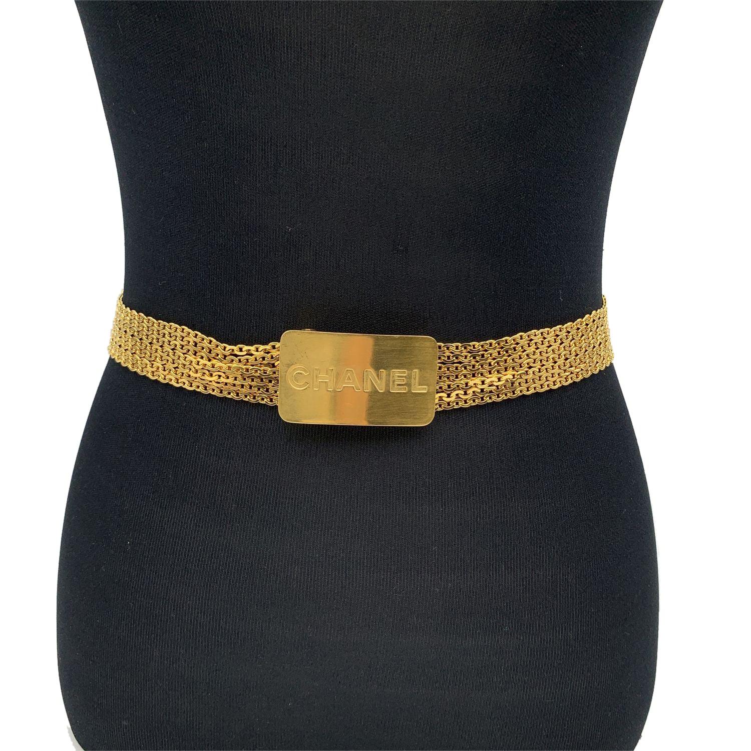Vintage Chanel gold metal multichain belt . Period/Era: 1996. It is very versatile and will complete every look. It features a rectangular tab with engraved CHANEL signature. Hook closure. Total length: 27.5 inches - 69.8 cm . Height: 1 inch - 2.5