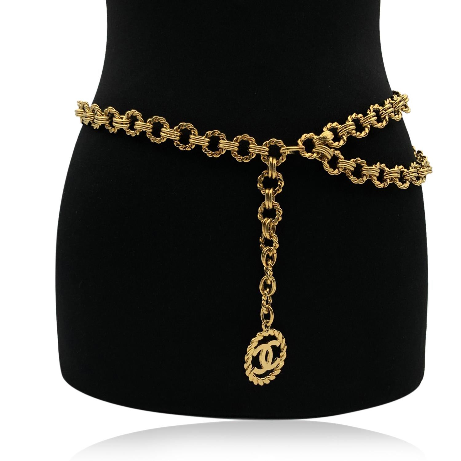 Classic vintage Chanel gold metal chain belt . Period/Era: late 80s/early 90s. It is very versatile and will complete every look (you can use it as a necklace or as a belt). It features 'CC CHANEL' pendant. Hook chain closure. Total lenght: 39