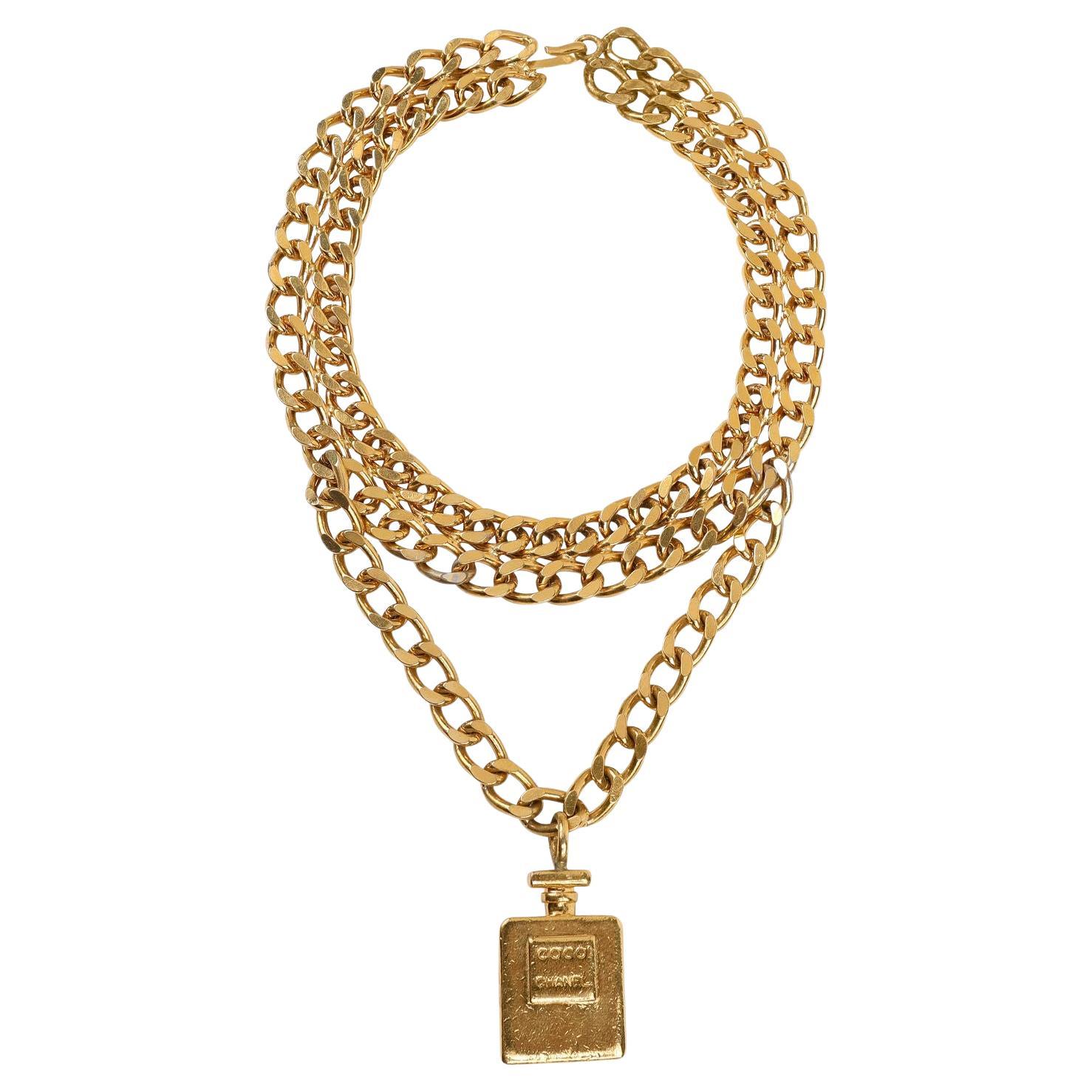 Chanel Collier choker vintage en forme de bouteille de parfum en or en vente