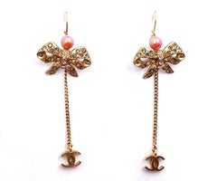 Chanel Vintage Gold Plated Ribbon Crystal Coral CC Dangle Lever Back Earrings