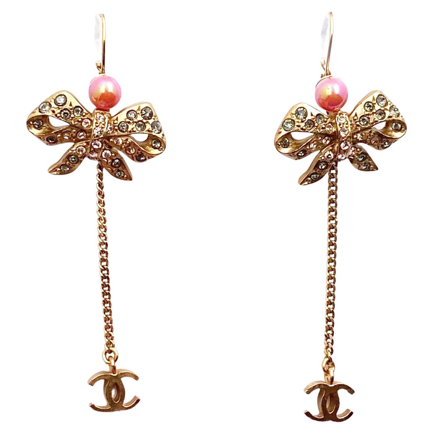 Chanel Vintage Gold Plated Ribbon Crystal Coral CC Dangle Lever Back Earrings For Sale