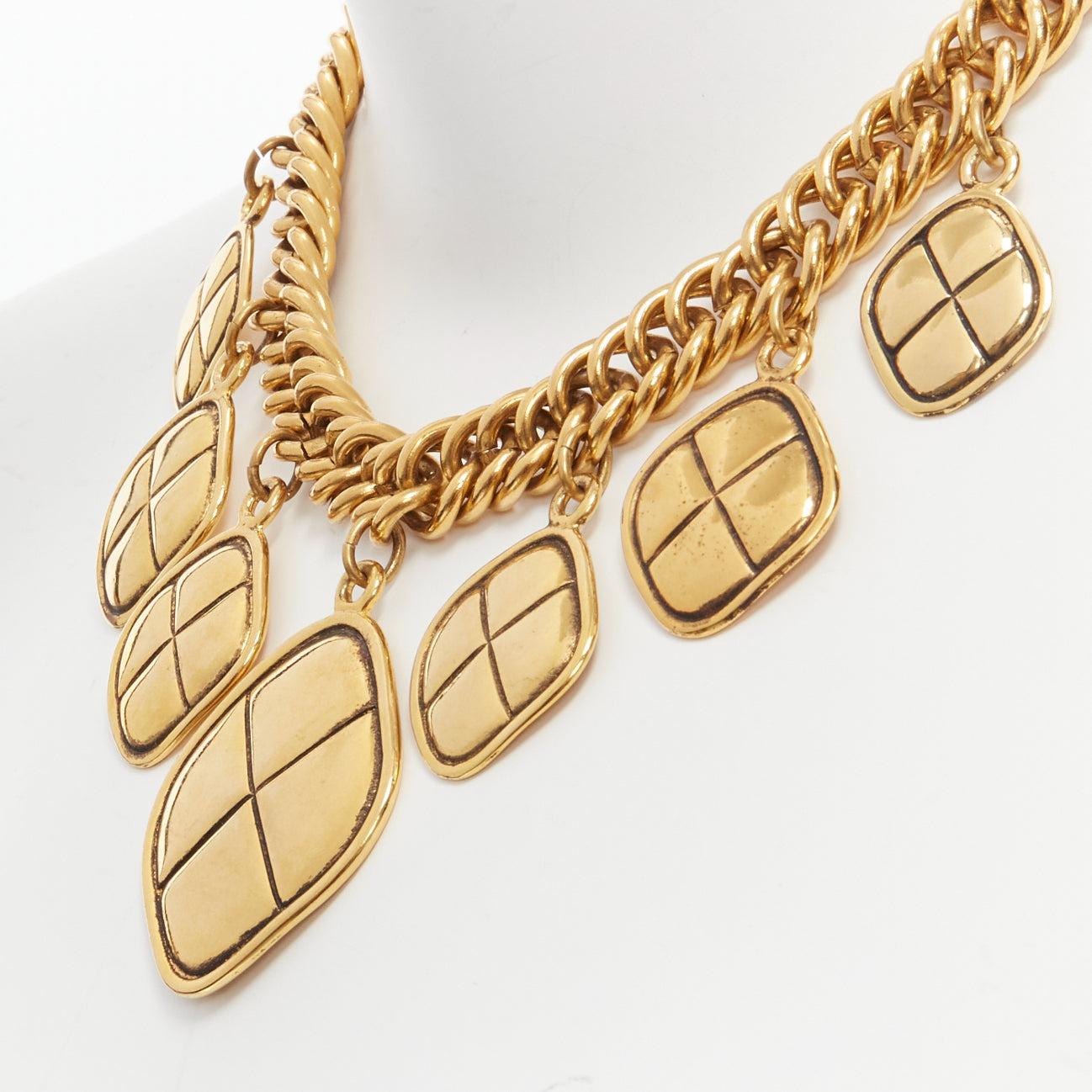 CHANEL Vintage gold quilted Rhombus charm chain choker necklace
Reference: TGAS/D00750
Brand: Chanel
Designer: Karl Lagerfeld
Collection: Circa 1990's
Material: Metal
Color: Gold
Pattern: Solid
Closure: Lobster Clasp
Lining: Gold Metal
Made in: