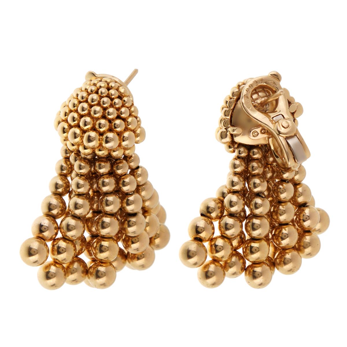 A magnificent pair of vintage Chanel earrings featuring a tassle drop motif in 18k yellow gold. The free flowing design is perfect for a night out on the town. The earrings measures 1.45