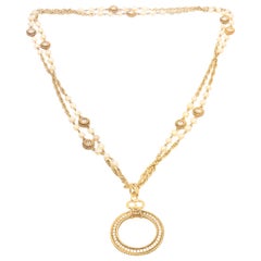 Chanel Vintage Gold Tone Faux Pearl Magnifying Glass Medallion Necklace