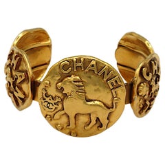 CHANEL Vintage Gold Tone Lion Medallion Bangle Bracelet