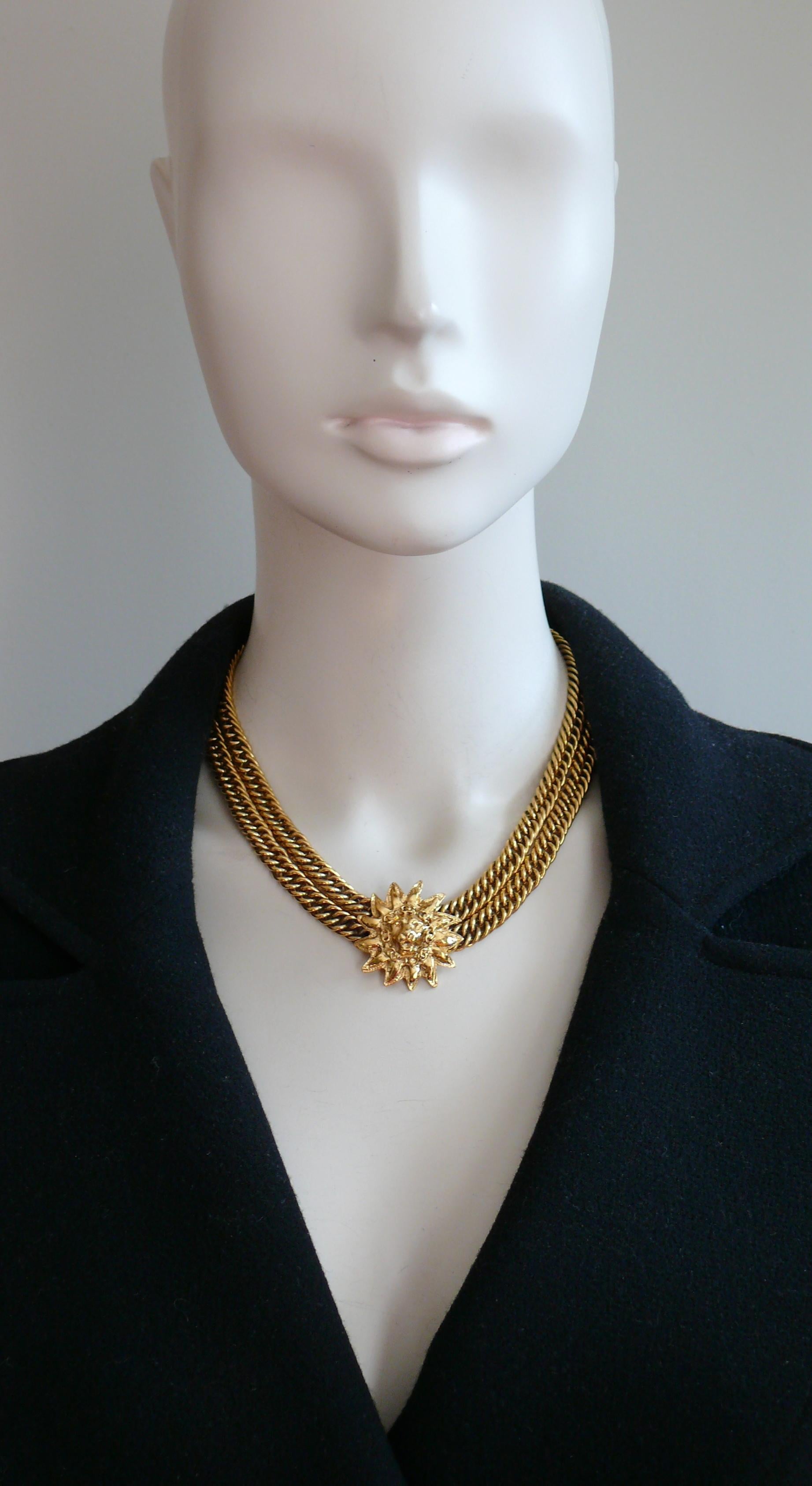 CHANEL vintage gold toned double curb chain necklace featuring an iconic 3D sunburst lion head central medallion adorned by CC logos.

A classic CHANEL iconic piece of jewelry.

Hook and eye closure.

Embossed CHANEL Made in France.

Indicative