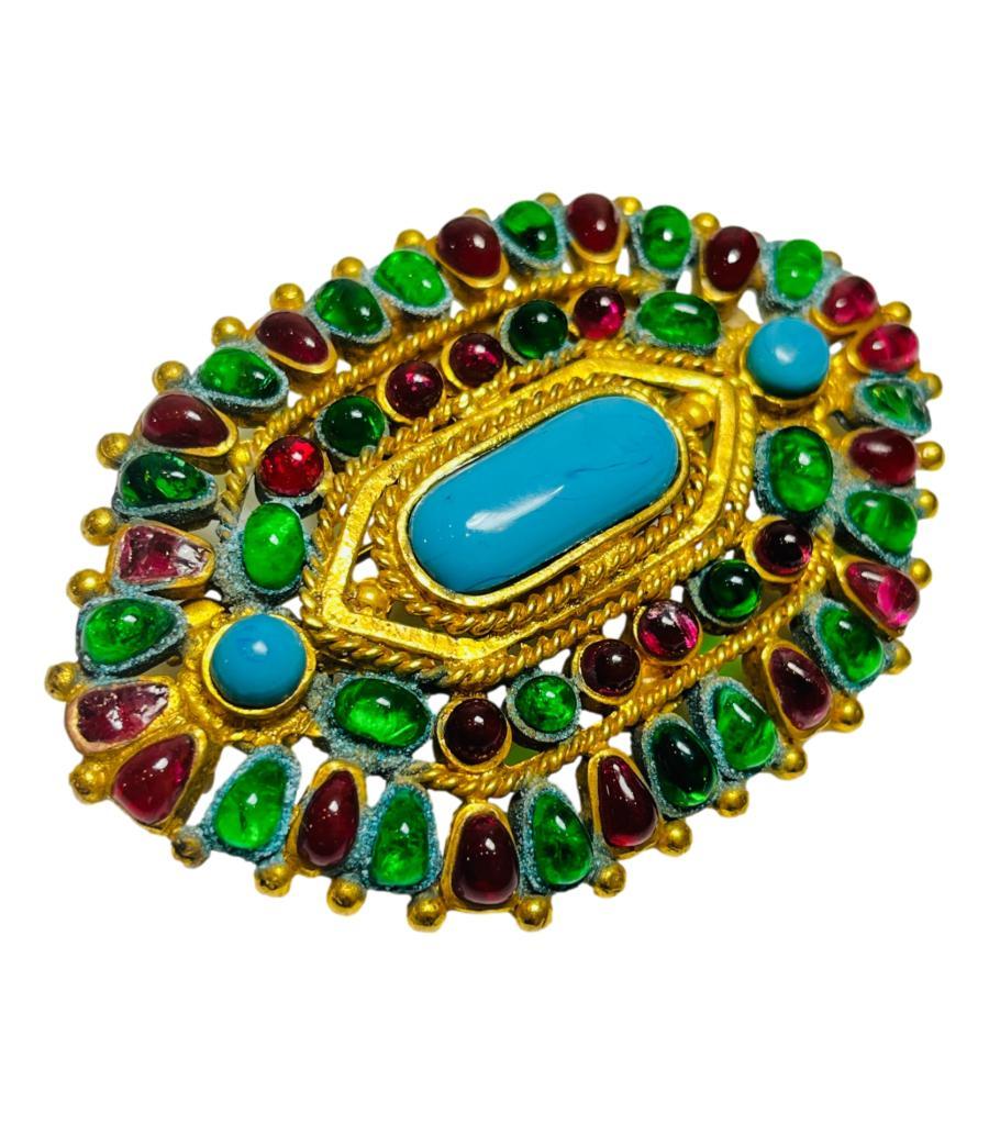 Rare Item - Chanel Vintage Gripoix Mughal Brooch

Antique gold open work patterned brooch embellished with multicoloured glass cabochons.

Detailed with Chanel's signature chain inspired details and turquoise placed in the centre.

Featuring hook