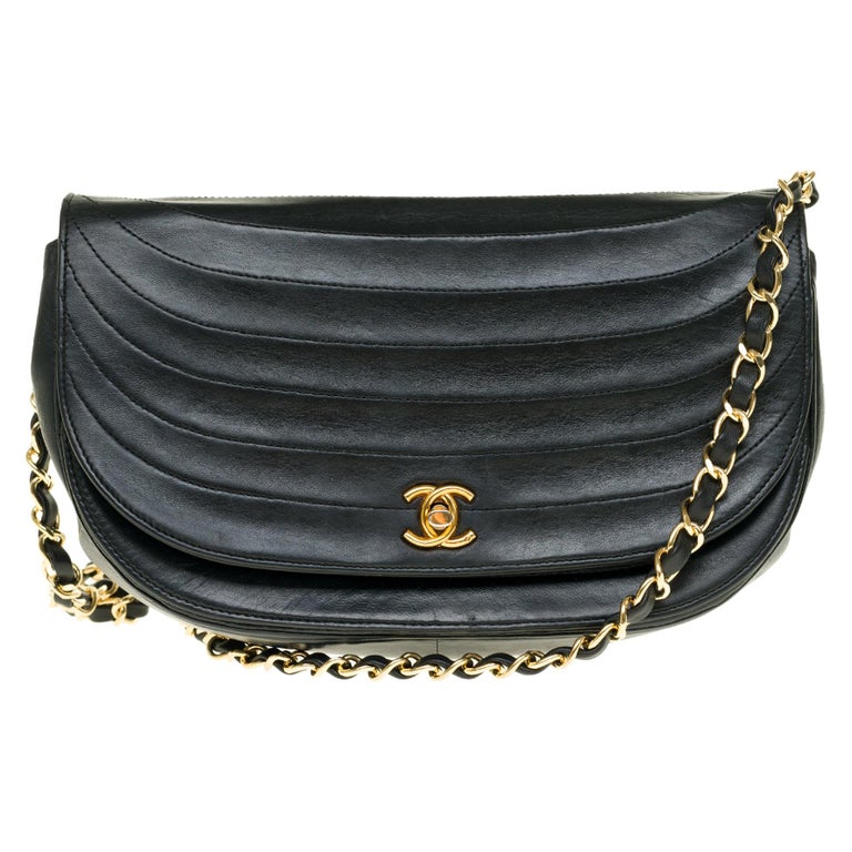 Chanel vintage half moon handbag in black quilted leather, Gold hardware at  1stDibs
