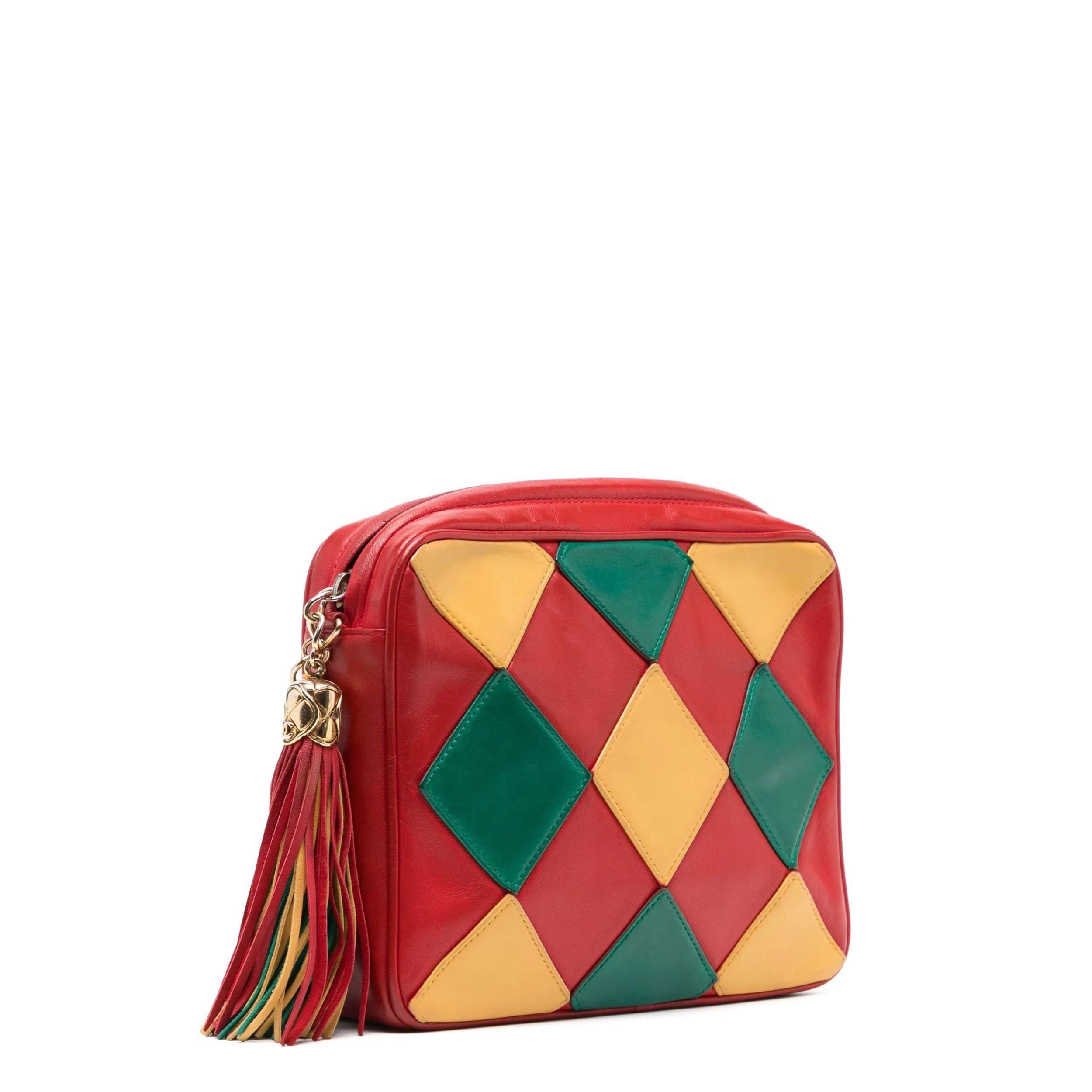 - Circa 1989 - 1991
- Multicolour
- Harlequin pattern
- Red leather
- Yellow and green sewn-on diamonds
- Gold-tone hardware
- Leather interwoven link chain shoulder strap
- Gold CC logo zipper with decorative tassel
- Red leather interior
-