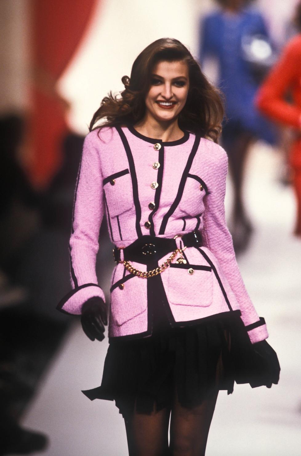 This striking Chanel tweed jacket is from the Chanel Haute Couture Spring/Summer 1991 Runway Collection, designed by the legendary Karl Lagerfeld. Crafted in a vibrant bubblegum pink tweed, this piece perfectly captures the bold and playful 