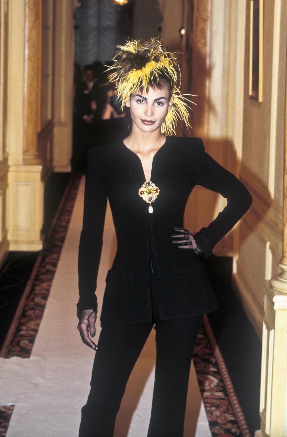 This black Haute Couture blazer from Chanel Spring/Summer 1996 collection is the epitome of elegance and sophistication. This 