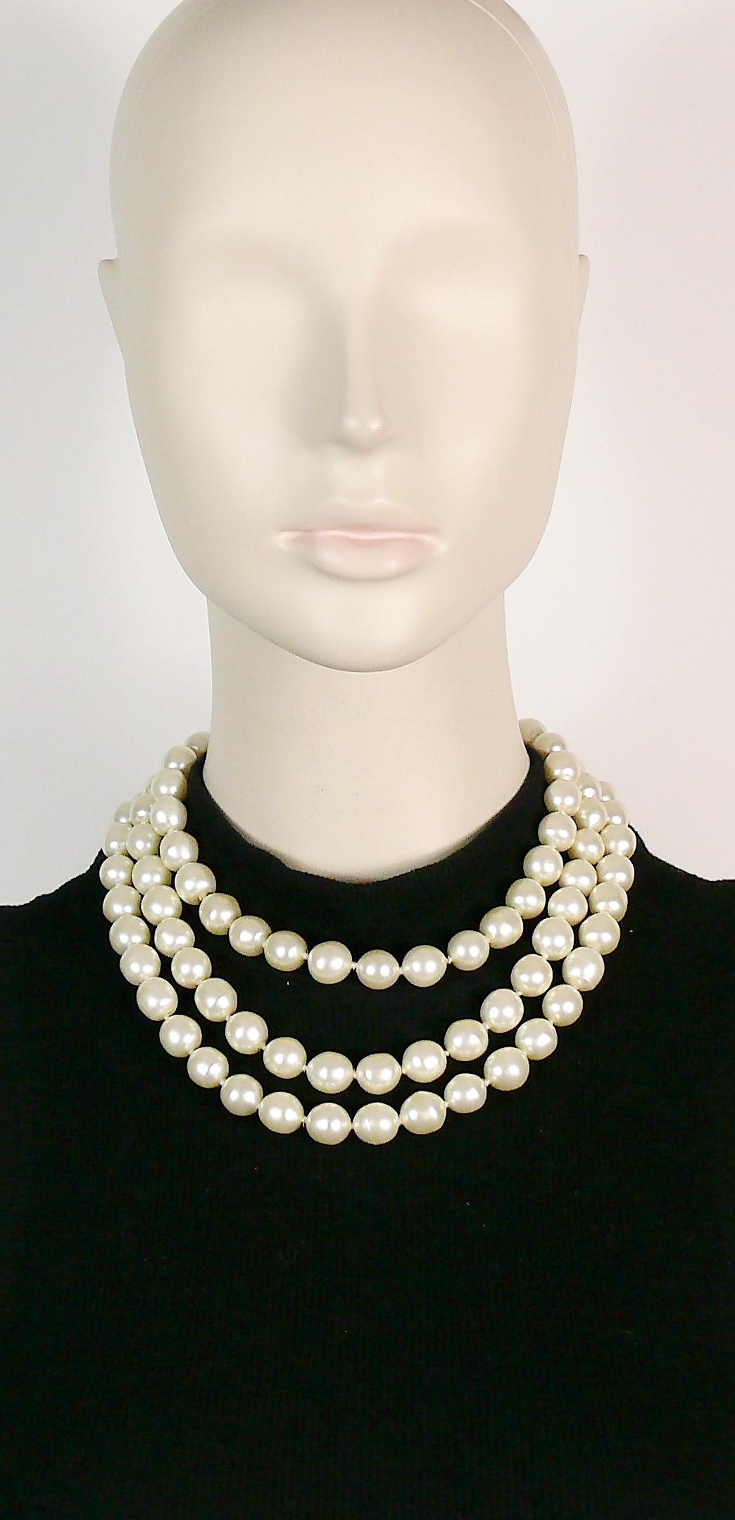 CHANEL vintage iconic triple strand glass pearl necklace with gold toned hardware.

Hook clasp closure

Embossed CHANEL Made in France.

Indicative measurements : lenght approx. 40.5 cm (15.94 inches).

JEWELRY CONDITION CHART
- New or never worn :