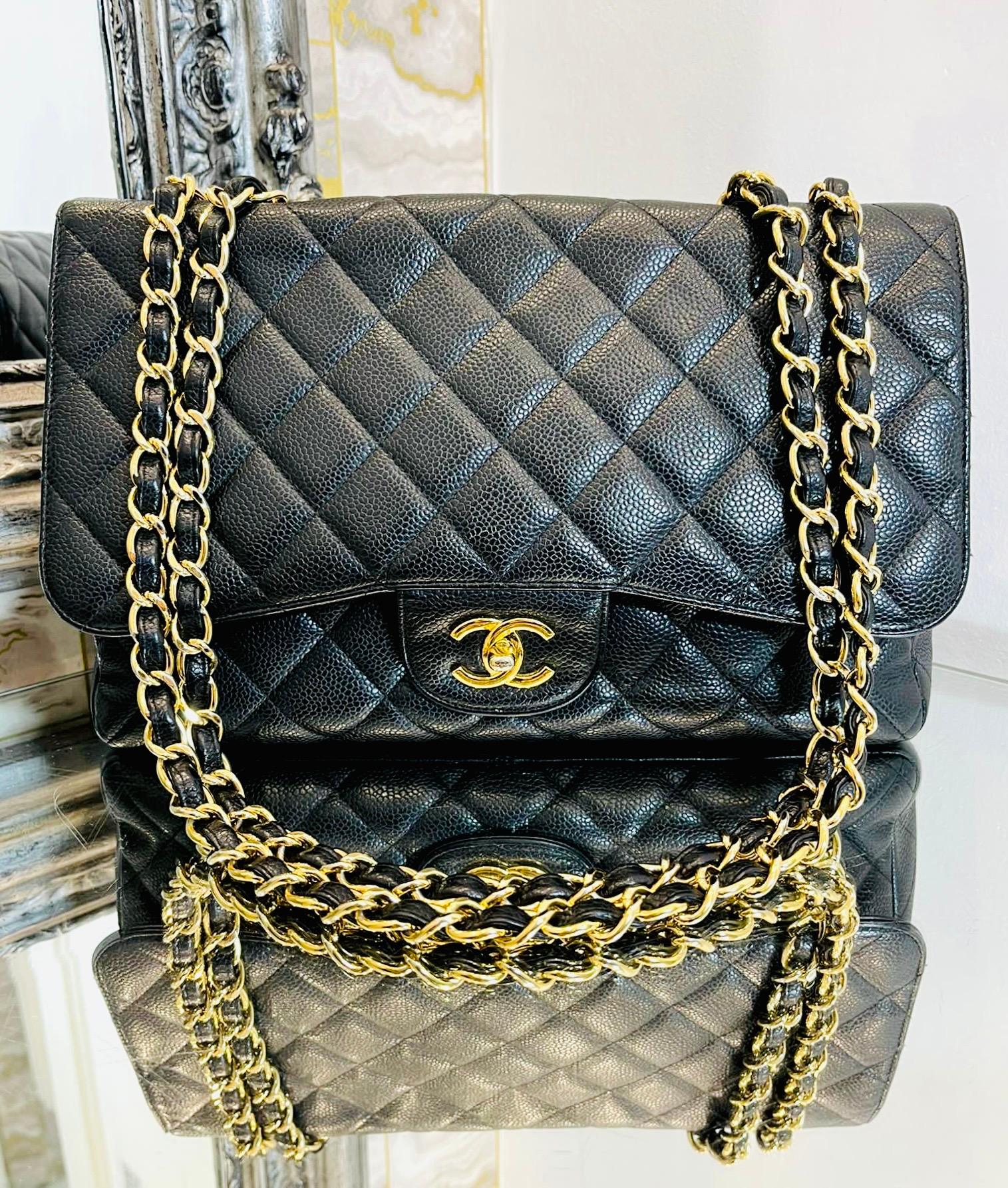 Chanel Vintage Jumbo Classic Caviar Leather Flap Bag With 24k Gold Plated Hardware

Black shoulder bag designed with iconic diamond quilting and 24k gold plated hardware.

Detailed with front flap and gold 'CC' turn-lock closure leading to leather