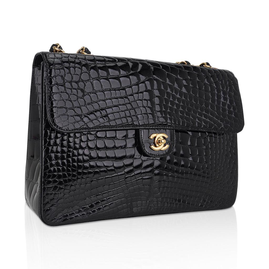 Chanel Jumbo Single Flap vintage bag featured in Black alligator skin.
Chanel no longer produces exotic skin or single flap bags, and to find one in such superb condition puts it on the collectors must have list.
This is rare timeless Chanel