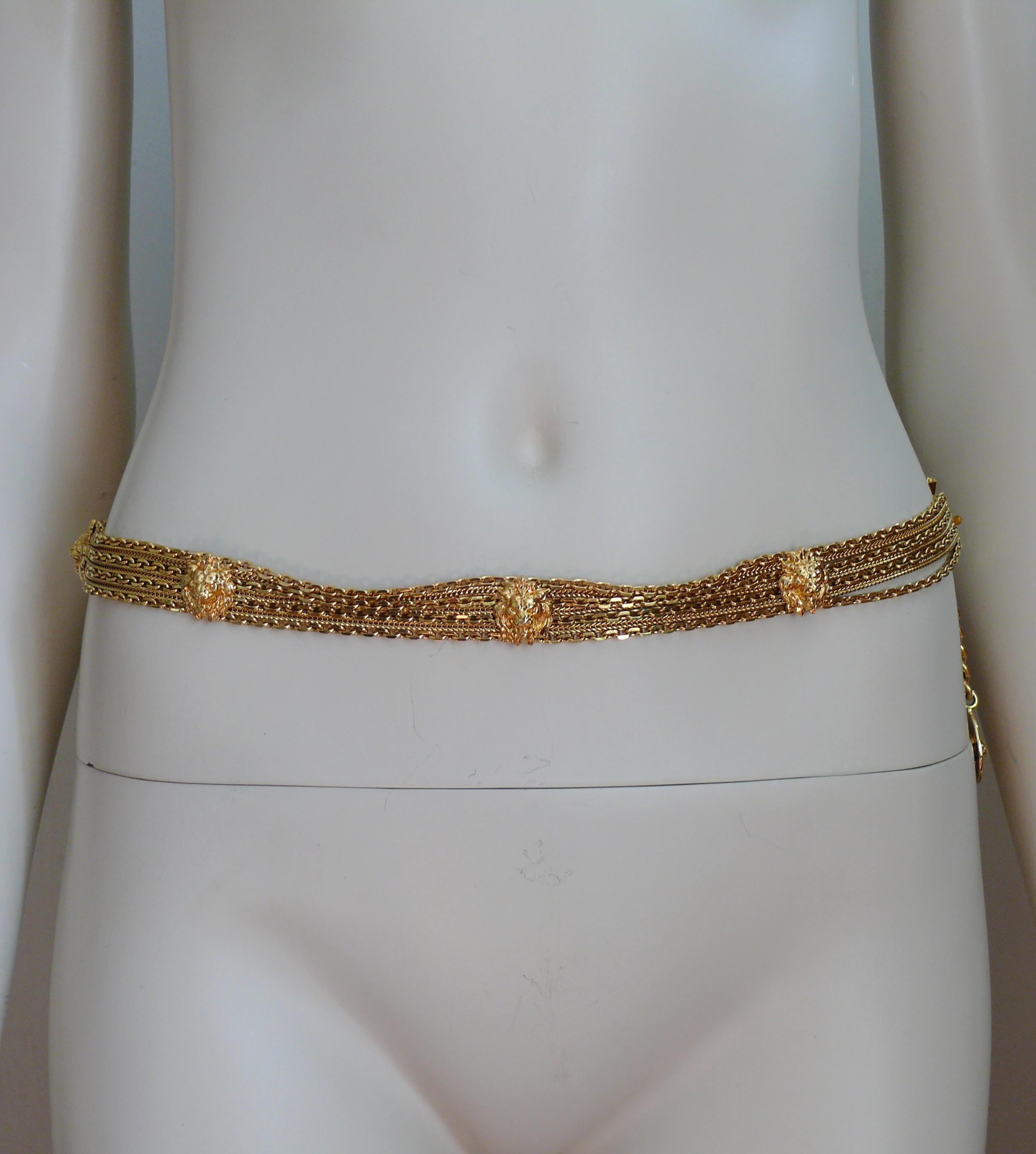 CHANEL vintage rare gold toned multi chain belt featuring seven 3D iconic lion head medallions. This belt terminates with CC logo and lion head coin charm.

Adjustable hook closure.

Embossed CHANEL on the hook closure.

Indicative measurements :