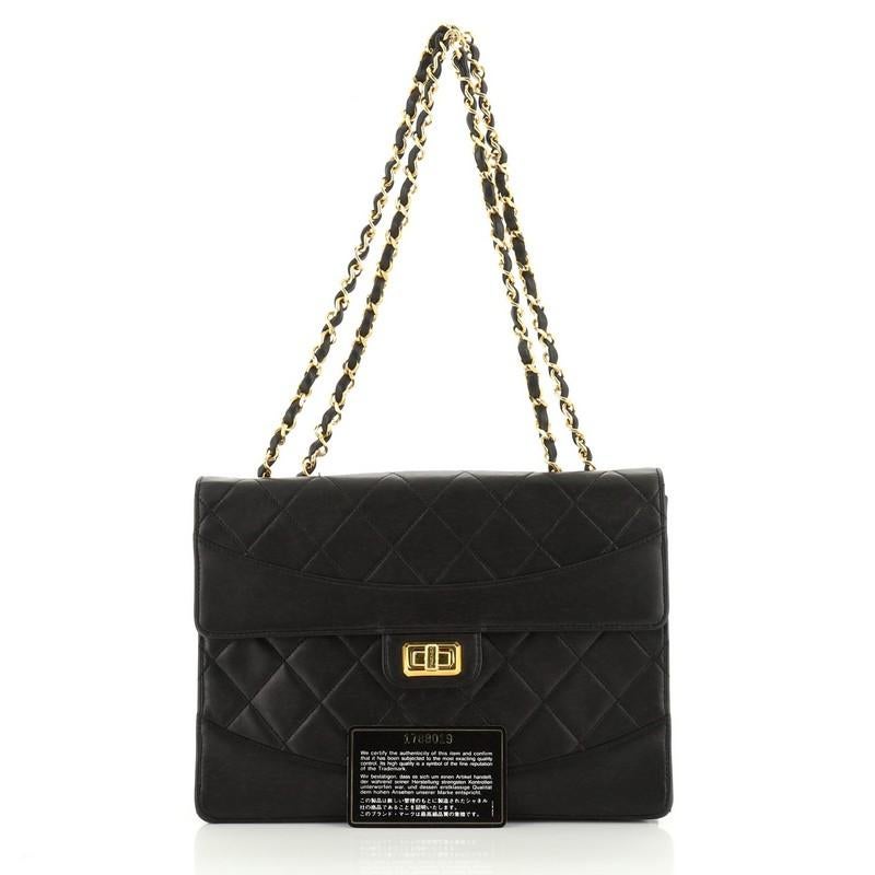 This Chanel Vintage Mademoiselle Flap Bag Quilted Lambskin Medium, crafted in black quilted lambskin, features woven-in leather chain link strap and gold-tone hardware. Its turn-lock closure opens to a red leather interior with slip pocket. Hologram