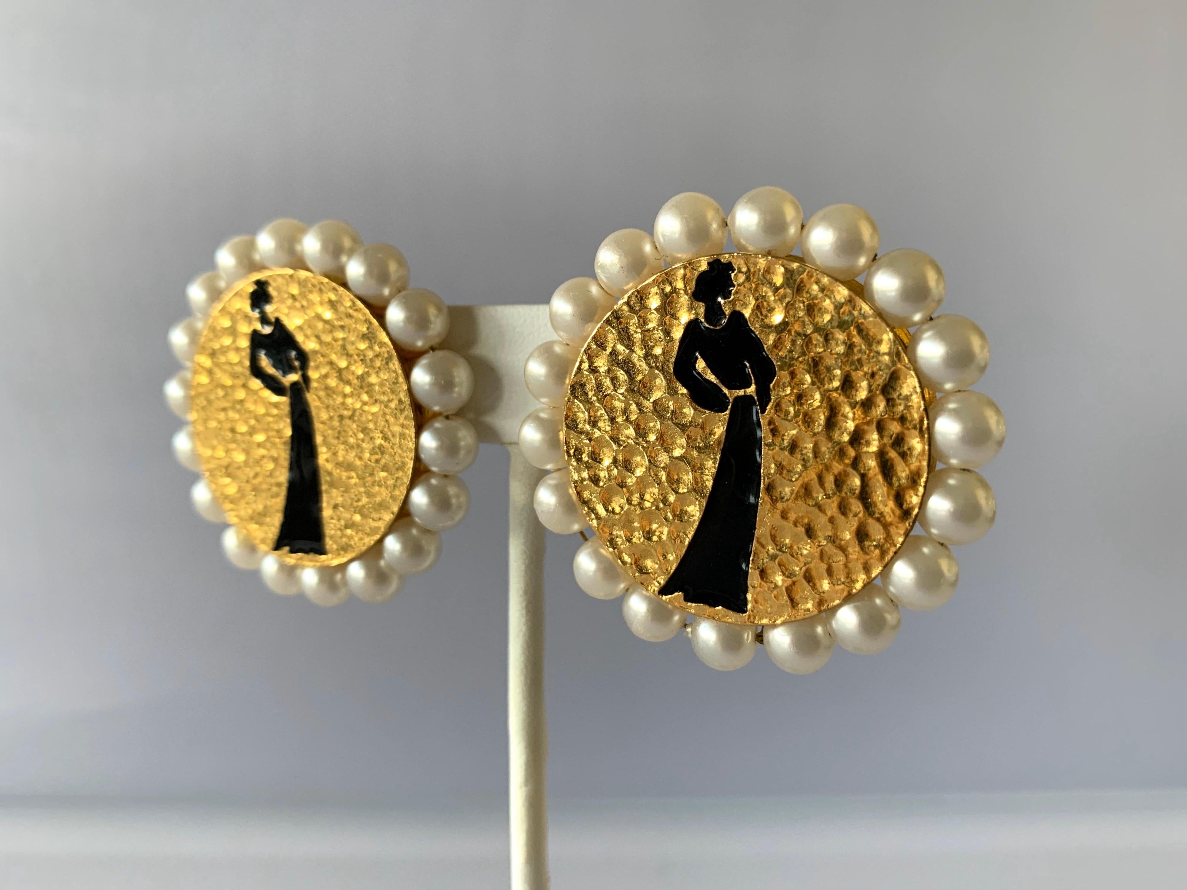 Scarce Chanel vintage clip-on earrings - comprised of gilt metal the circular earrings feature a black silhouette of Mademoiselle Chanel with classic Chanel pearls around the earrings (stamped Chanel, made in France) on the back.