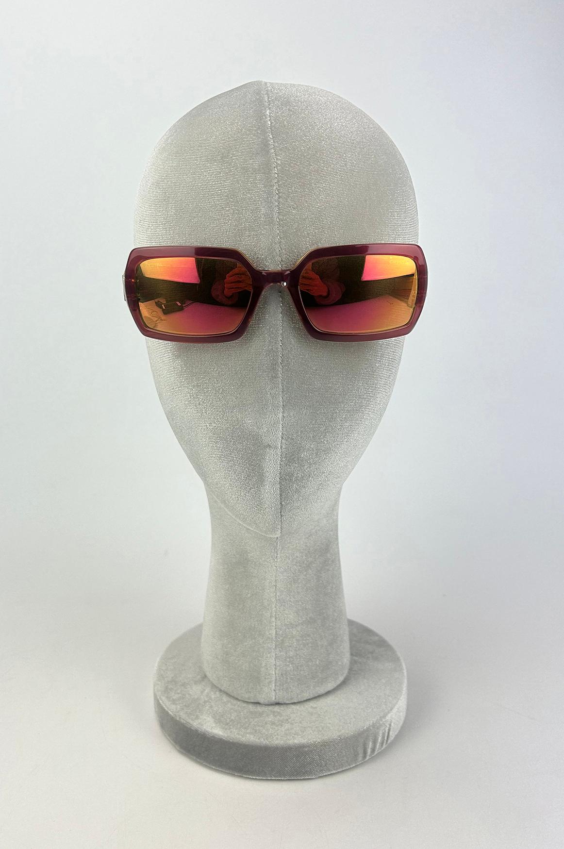 Chanel Vintage Maroon and Green Crystal Lens Sunglasses in excellent condition. Maroon front frame with green backing in classic square eye design. CC logo charms on each end of arm at eyes. stamped and signed by chanel made in Italy with serial