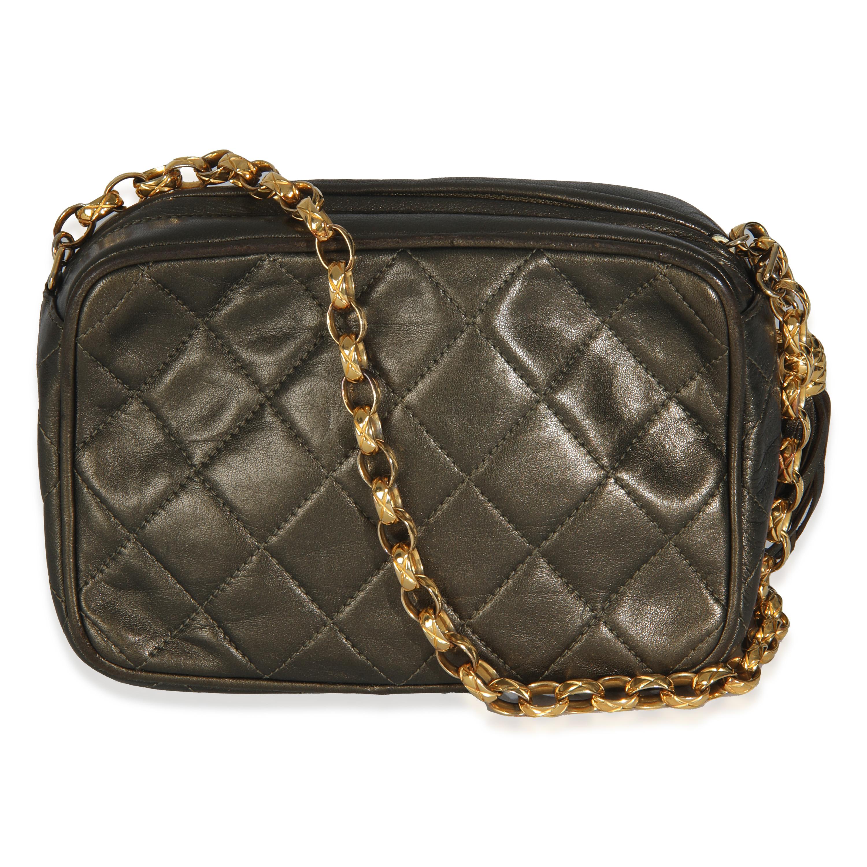 Listing Title: Chanel Vintage Metallic Green Quilted Lambskin Tassel Camera Bag
SKU: 146012
Condition: Pre-owned 
Handbag Condition: Very Good
Condition Comments: Item is in very good condition with minor signs of wear.  Peeling and scuffing along