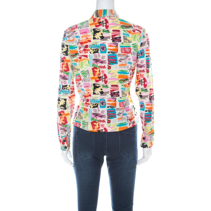 When it comes to wearing a Chanel creation, you are bound to make an impression! This shirt is made of a silk blend and features a multicolour abstract printed pattern all over it. It flaunts a cropped design, front button fastenings and long cuffed