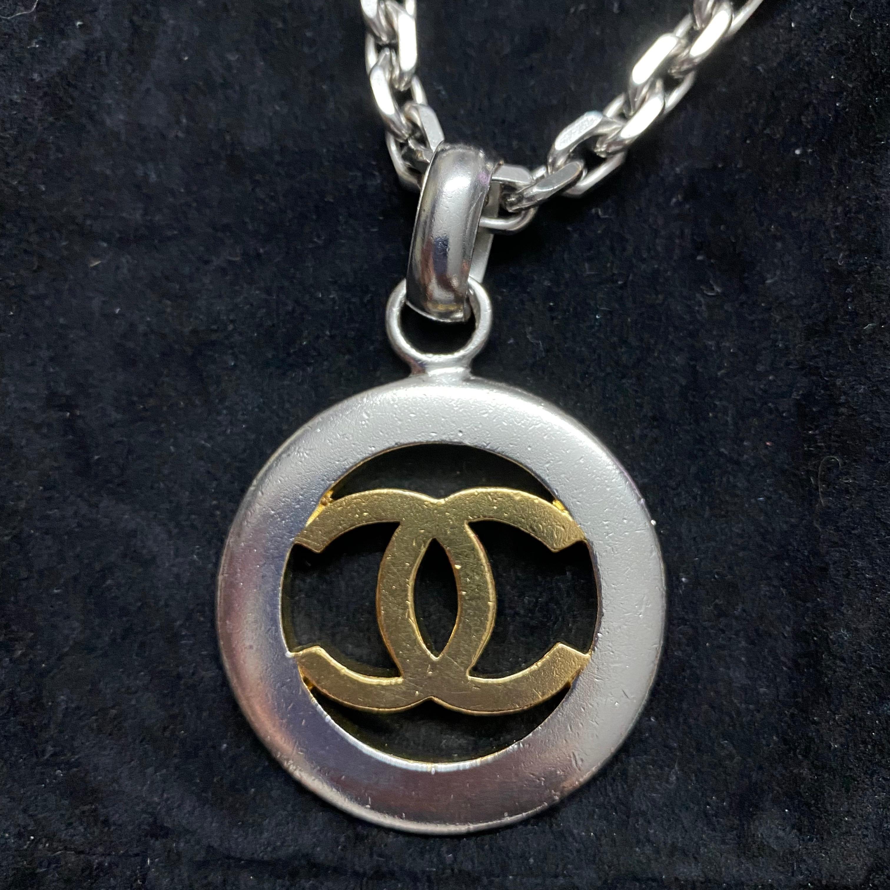 Chanel Vintage -  Necklace with CC pendant in Gold and Silver coated Metal 1