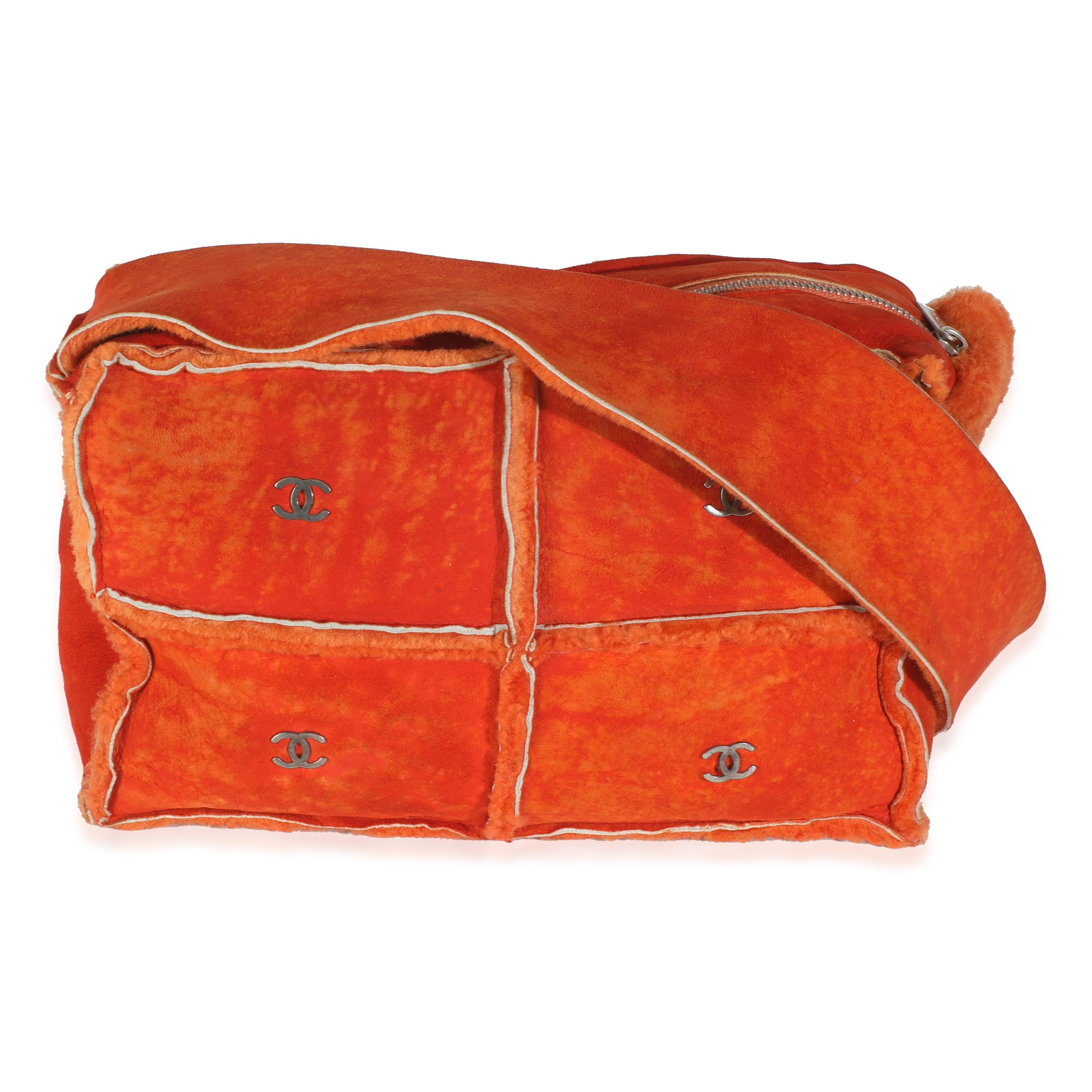 Listing Title: Chanel Vintage Orange Suede Shearling CC Logo Messenger
SKU: 146000
Condition: Pre-owned 
Condition Description: With all the hallmarks of a classic Chanel accessory, this CC quilted card holder features the house’s iconic logo plaque
