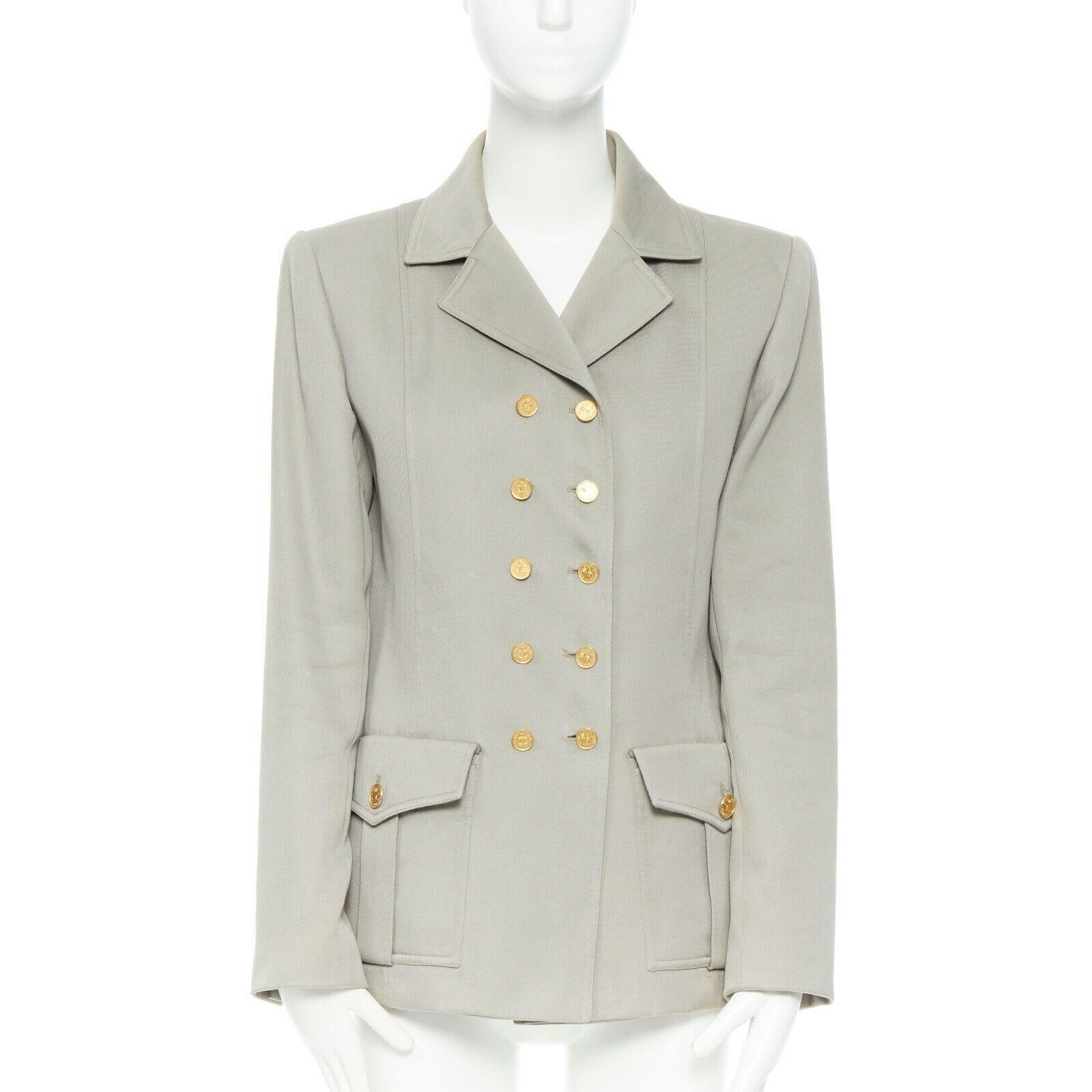 CHANEL Vintage pale grey twill logo button double breast military blazer jacket
Brand: CHANEL
Designer: Karl Lagerfeld
Model Name / Style: Military jacket
Material: Other; composition label removed. Feels like wool/
Color: Grey
Pattern: