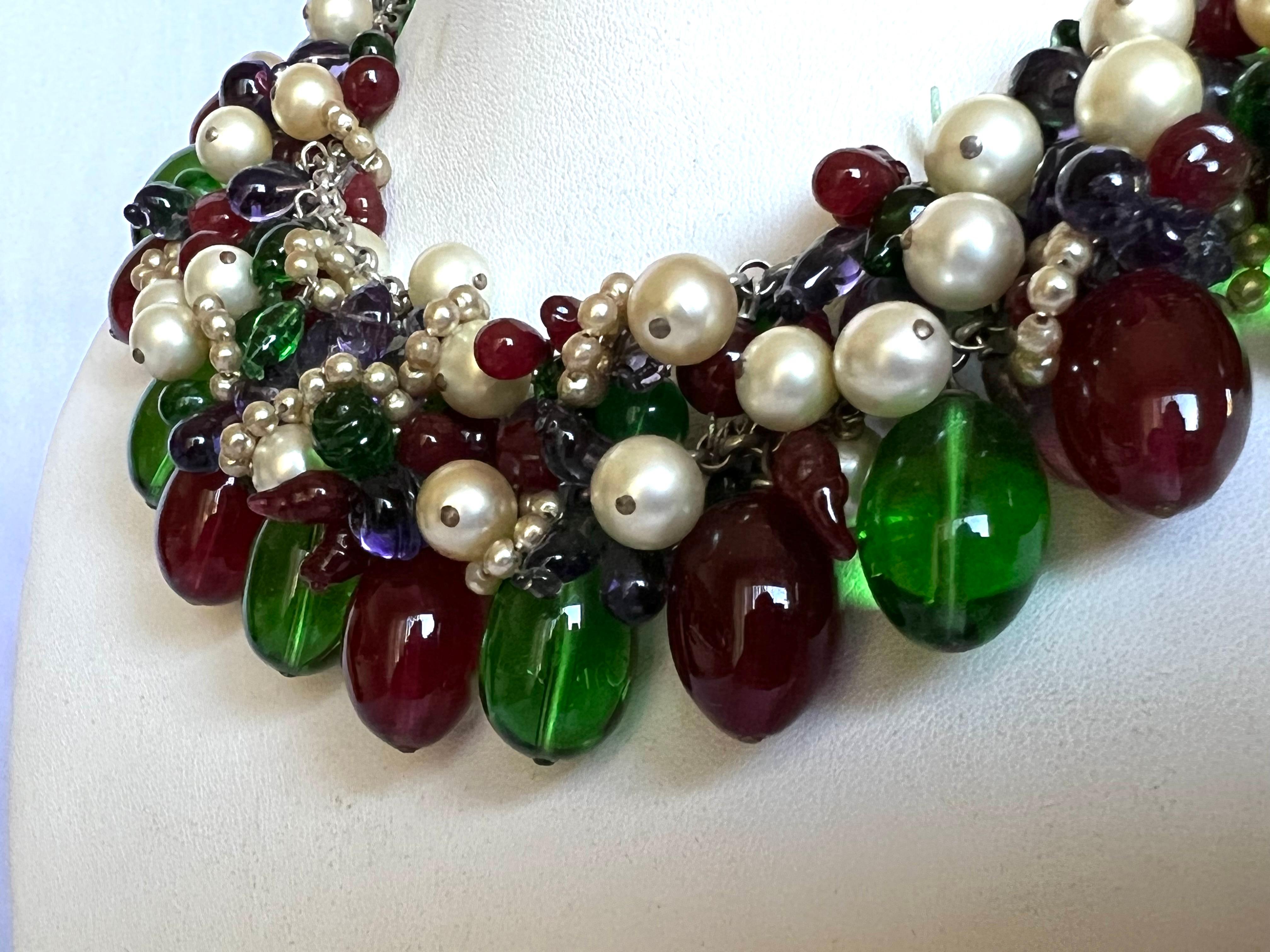 Scarce vintage Coco Chanel beaded statement necklace. The necklace is comprised of large blue, green, and red glass beads which are accented by a mixture of faux glass pearls. The design of this necklace is a classic 1930s design originated by
