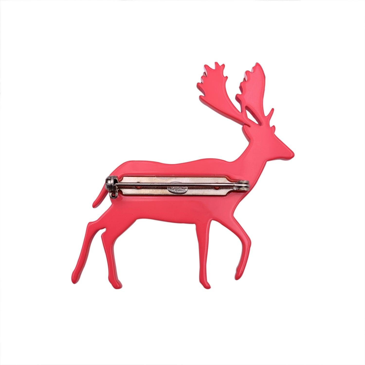 Chanel Pink Fuchsia Reindeer-shaped Brooch Pin from the 2001 collection. Crafted of fuchsia pink acrylic material. CC logos on the front. Safety pin closure. Measurements (HxW): 1.75 x 2 inches - 4.5 x 5.1 cm 'CHANEL - 01 CC A - Made in France' oval