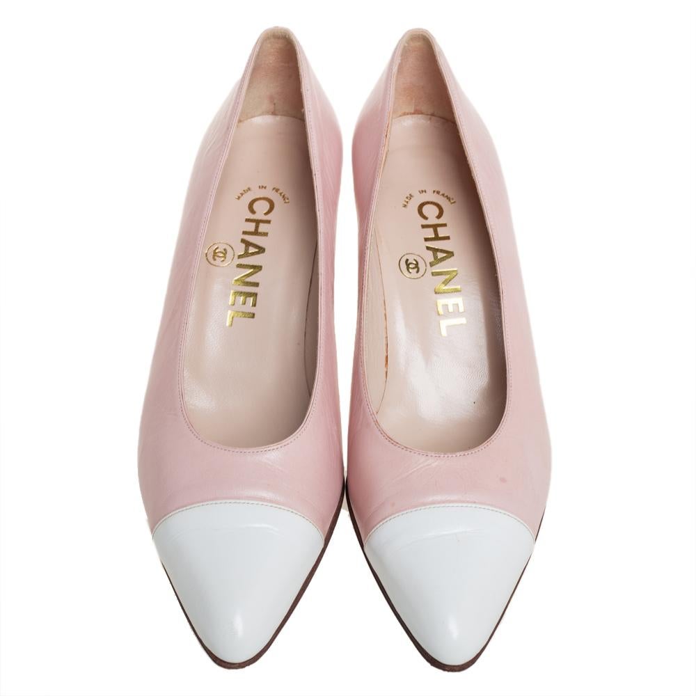 Chanel brings to you these lovely pumps to complement your fashionable ensembles. These pink pumps are crafted from leather and feature white pointed cap toes. They stand tall on 6.5 cm heels and come endowed with comfortable leather-lined insoles.

