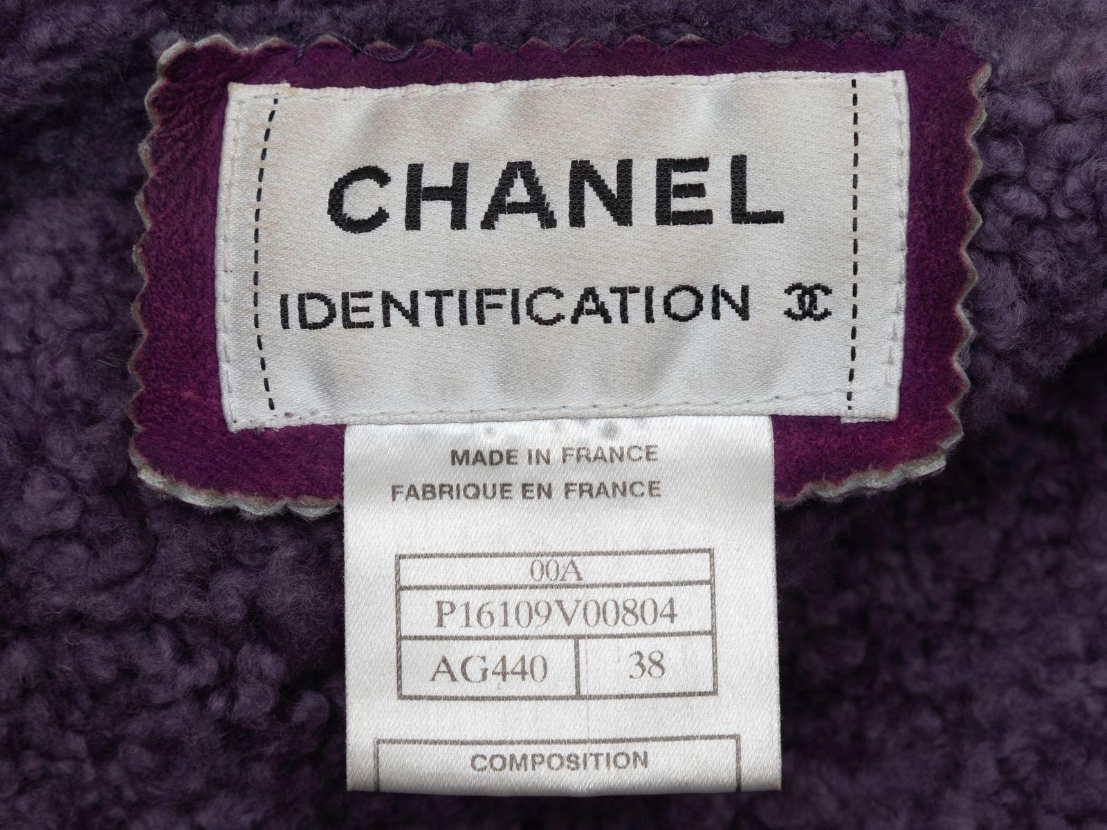 Product Details: Vintage purple shearling patchwork jacket by Chanel Identification. Circa 2000. Notched lapel. Dual welt pockets at hips. Zip closure at center front. 35