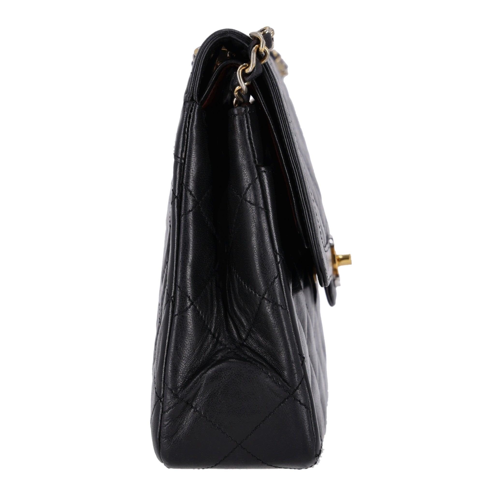 Chanel Vintage Quilted Leather Two Tone 'CC' Closure Double Flap Bag

Black lambskin leather with gold and sliver 'CC' twist lock closure and iconic leather cand chain strap.

Double flap and signature burgundy leather interior and 24k gold plated