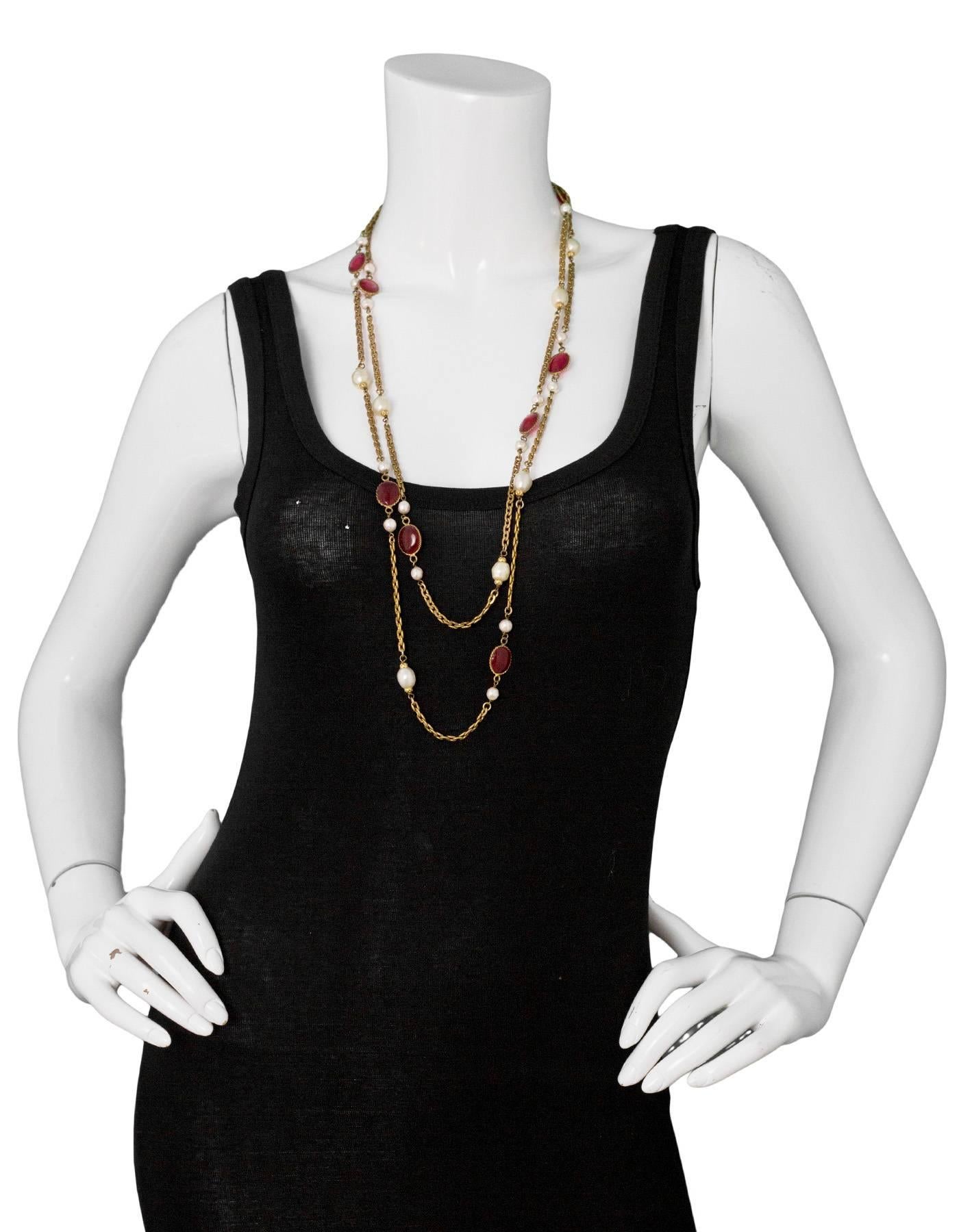 Chanel Vintage Red Gripoix & Faux Pearl Chain Necklace

Year of Production: 1983
Color: Gold, ivory, red
Materials: Metal, faux pearl, gripoix
Closure: Hook and eye closure
Stamp: Chanel CC 1983
Overall Condition: Excellent vintage pre-owned