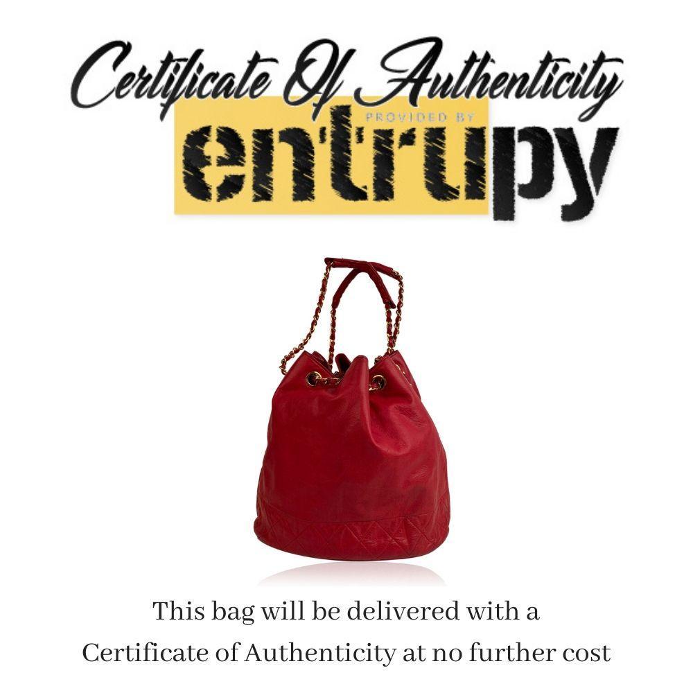 This beautiful Bag will come with a Certificate of Authenticity provided by Entrupy, leading International Fashion Authenticators. The certificate will be provided at no further cost. - Beautiful vintage CHANEL bucket - Made of red leather and